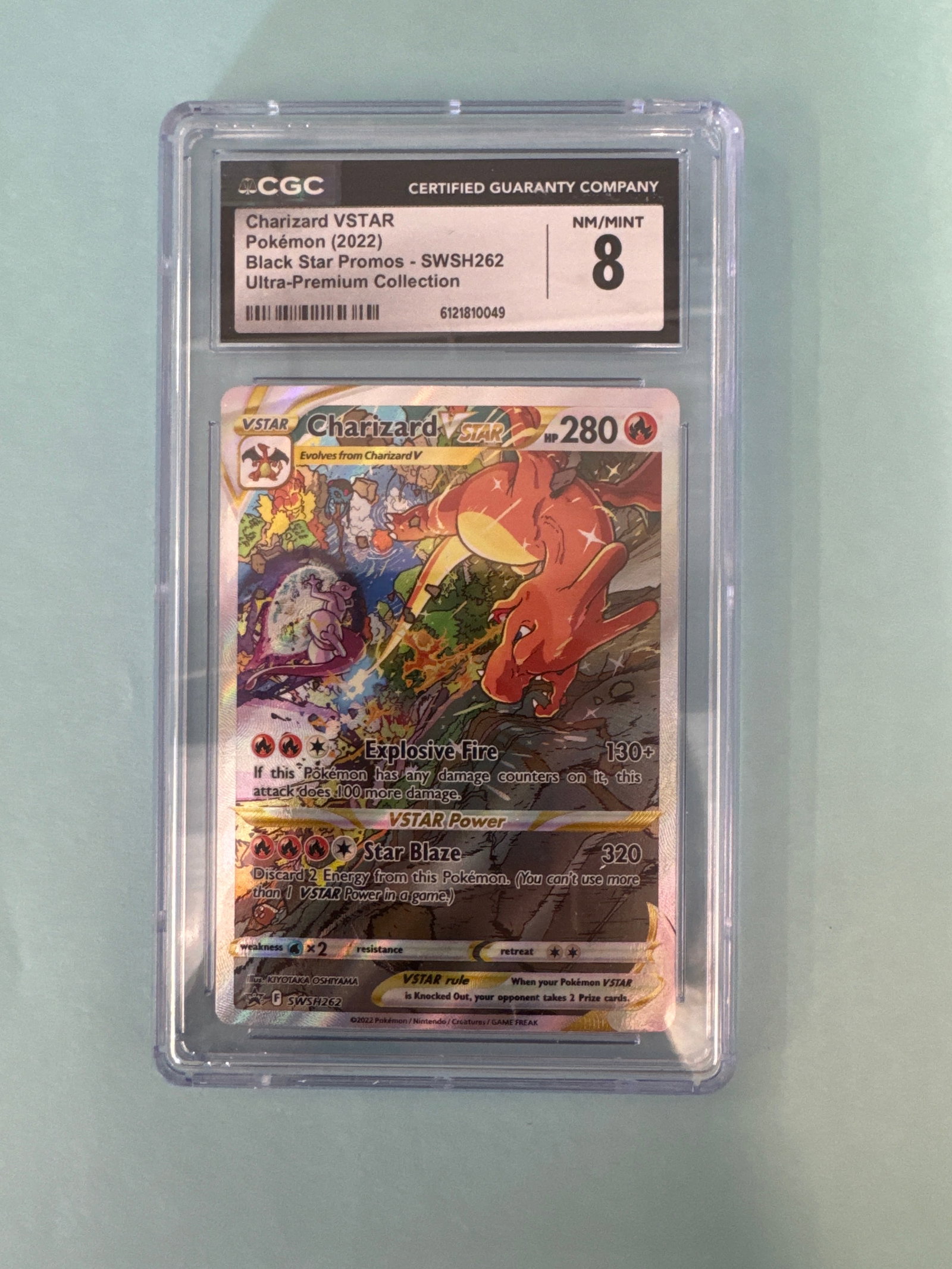 CGC Graded 8 Charizard VSTAR - SWSH262 Ultra-Premium Collection: CGC graded 8 Charizard VSTAR, card number SWSH262. From the Ultra-Premium Collection. Encased in protective CGC holder. Size: 12 x 7.9cm approx. Weight: 2oz. 