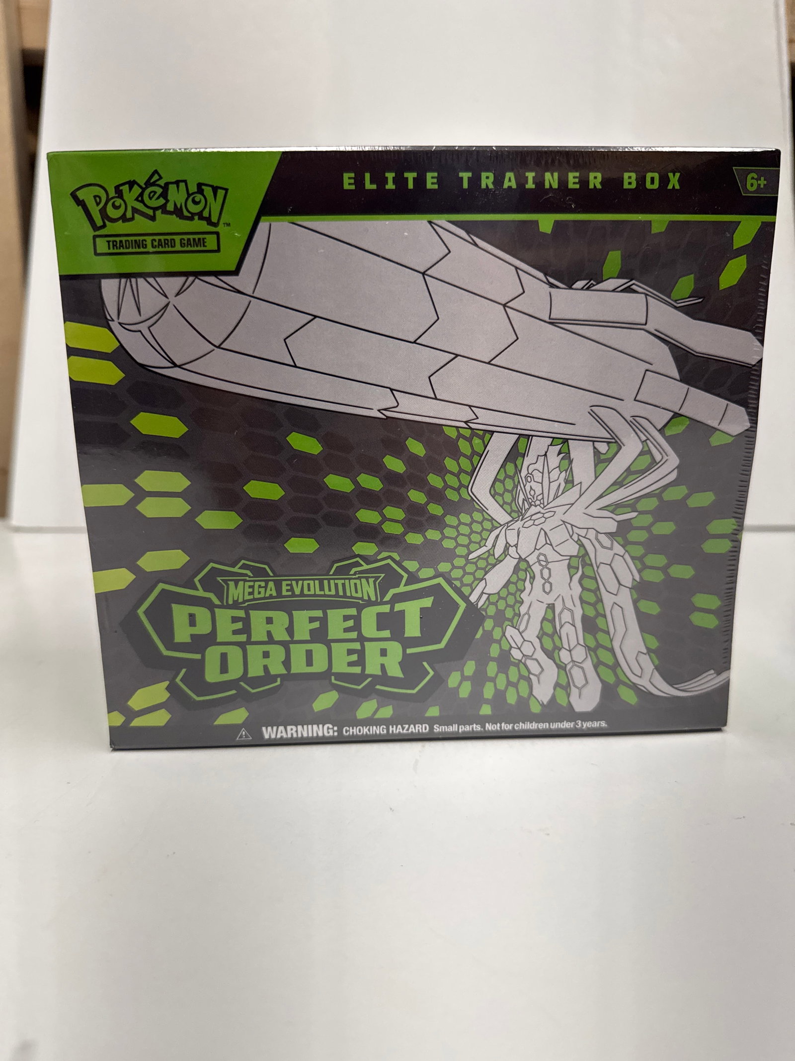 Pokemon TCG Mega Evolution Perfect Order Elite Trainer Box: This Pokemon Trading Card Game Elite Trainer Box features the Mega Evolution Perfect Order expansion. It includes 9 booster packs, a full-art promo card featuring Tyranitar, 65 card sleeves, 45 Energy