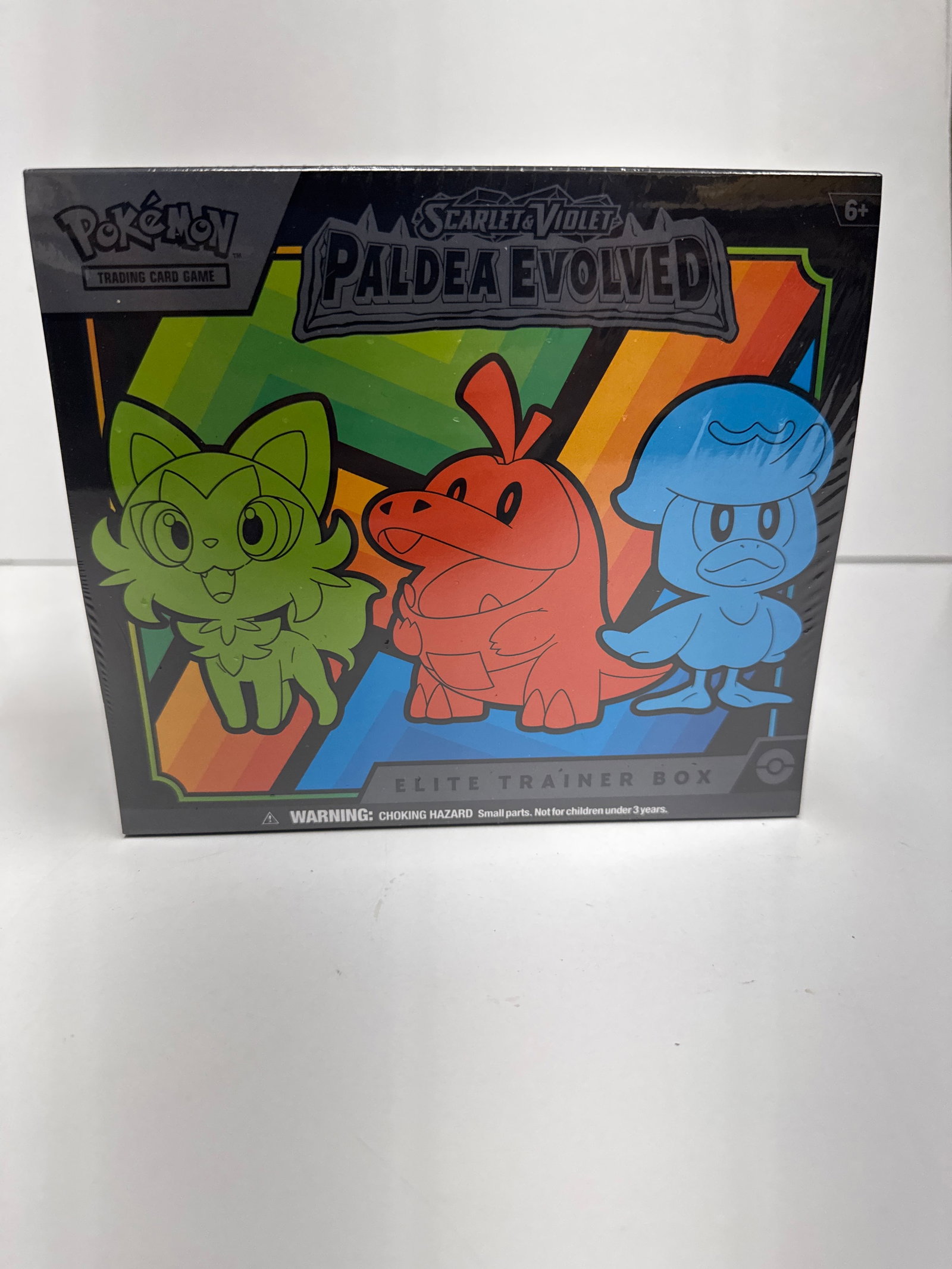 Pokemon Scarlet & Violet Paldea Evolved Elite Trainer Box: This is a sealed Pokemon Scarlet & Violet Paldea Evolved Elite Trainer Box. It includes 9 booster packs, full-art promo cards featuring Pikachu, 45 TCG energy cards, dice, damage counters, and a code 