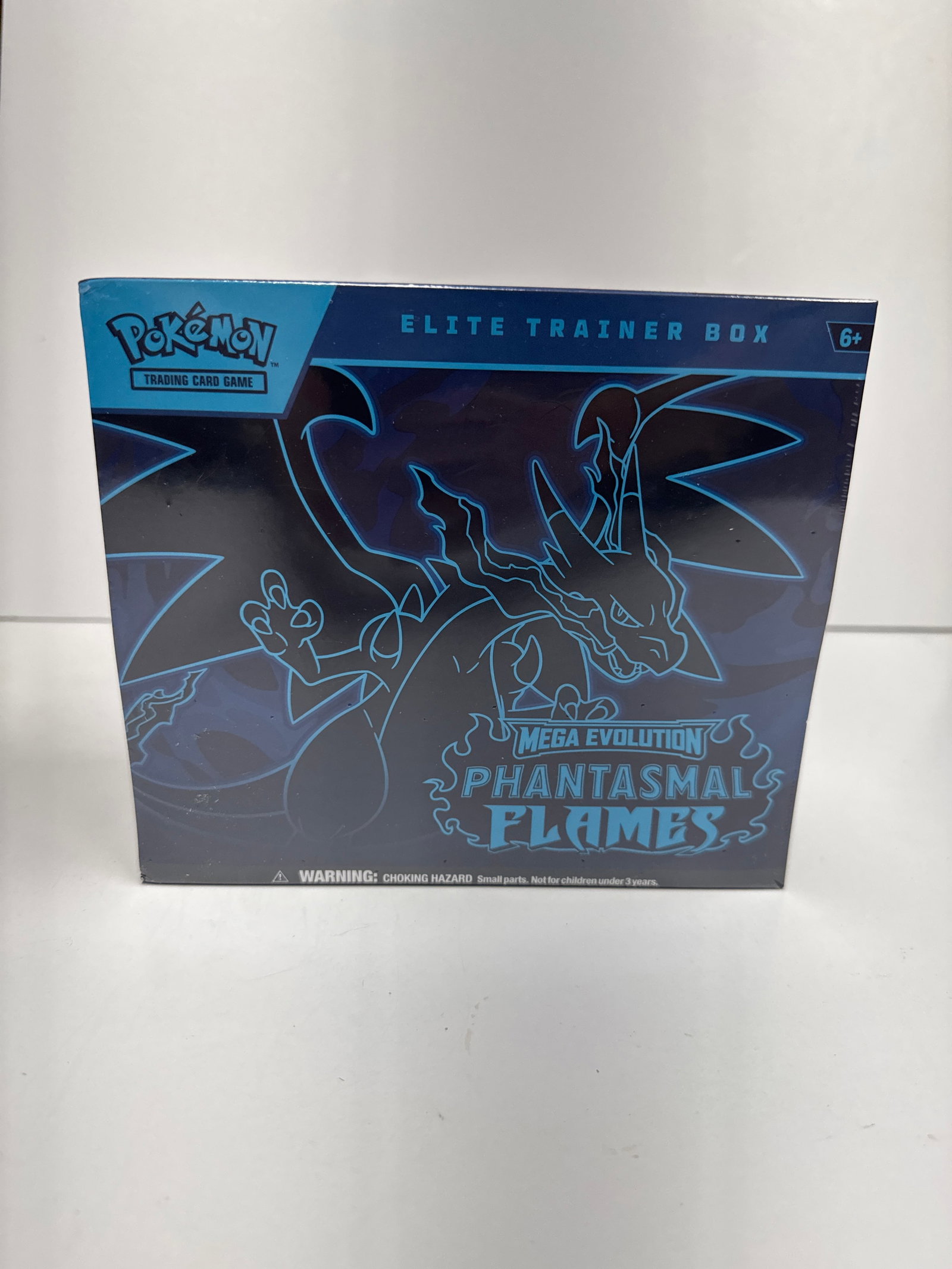 Pokemon TCG Mega Evolution Phantasmal Flames Elite Trainer Box: Ignite a Burning Spirit of Battle! This Elite Trainer Box features Mega Charizard and Mega Gengar. It includes 9 Pokemon TCG: Mega Evolutionâ€”Phantasmal Flames booster packs, a full-art p