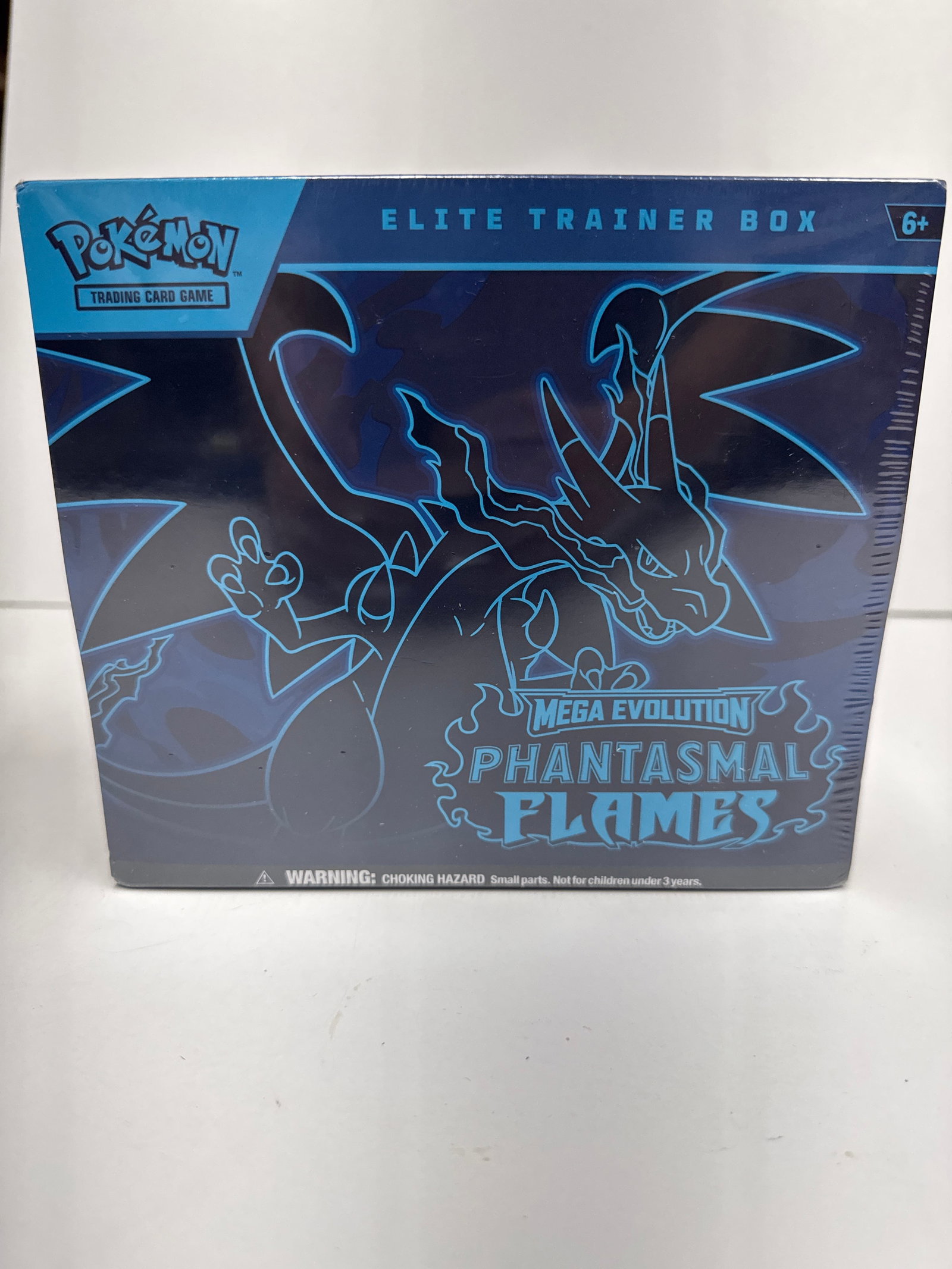 Pokemon TCG: Mega Evolution Phantasmals Flames Elite Trainer Box: This Pokemon TCG: Mega Evolution Phantasmals Flames Elite Trainer Box includes 9 Pokemon TCG booster packs, a full-art promo card featuring Charizard, 65 card sleeves, 40 Pokemon TCG energy cards, a r