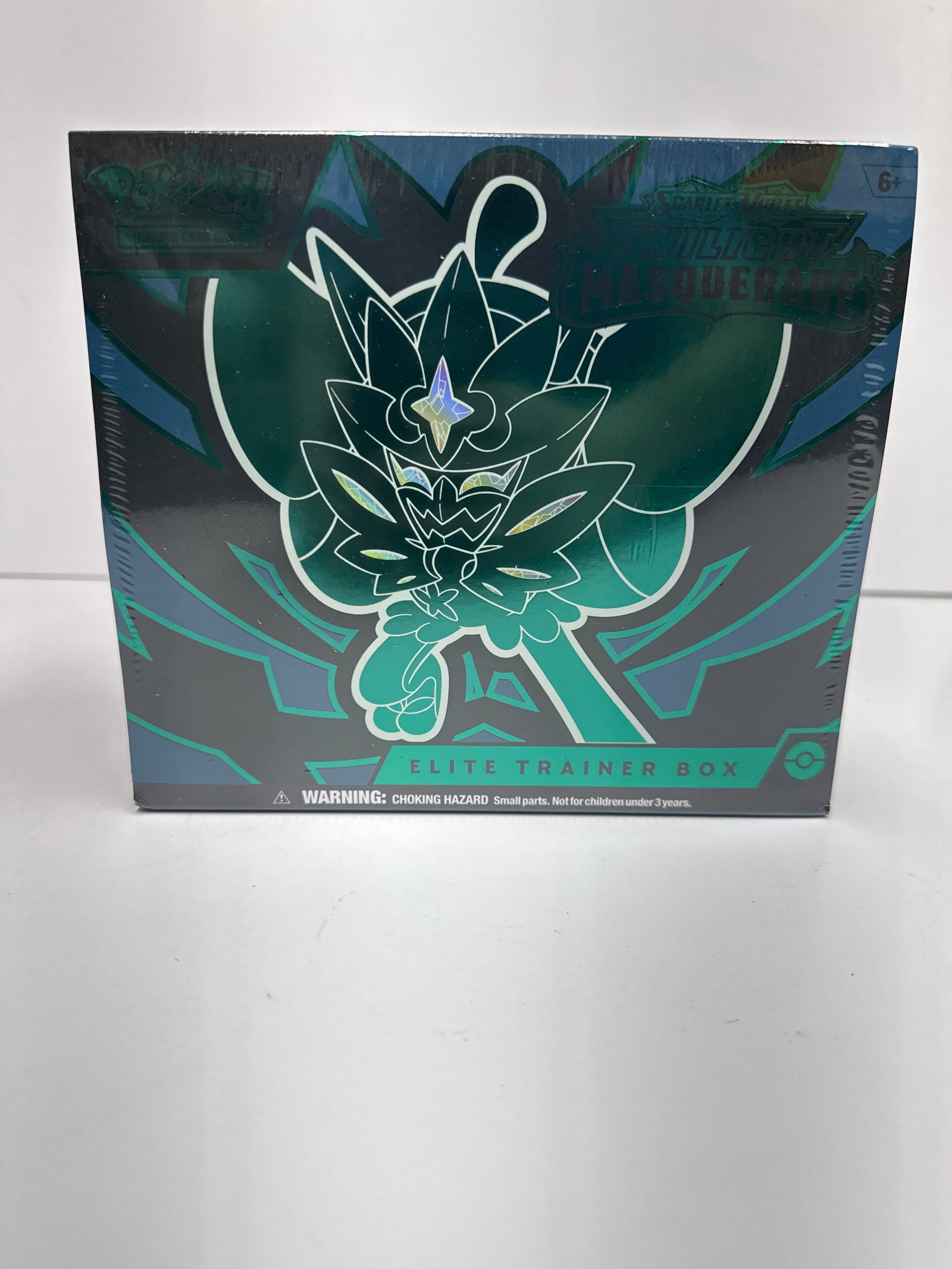 Pokemon TCG Scarlet & Violet - Twilight Masquerade Elite Trainer Box: This Pokemon TCG Elite Trainer Box features the Scarlet & Violet - Twilight Masquerade expansion. It includes 9 booster packs, 65 card sleeves, 45 Energy cards, player's guide, damage-counter dice, a 