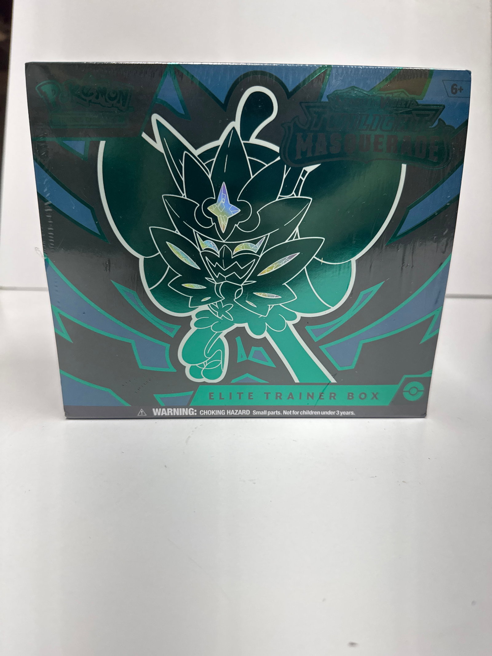 Pokemon TCG Scarlet & Violet - Twilight Masquerade Elite Trainer Box: Welcome to the land of Kitakami, where people and PokÃ©mon live harmoniously with nature. Uncover the mystery of the masked legendary PokÃ©mon Ogerpon, appearing as four distinct forms. This Elite