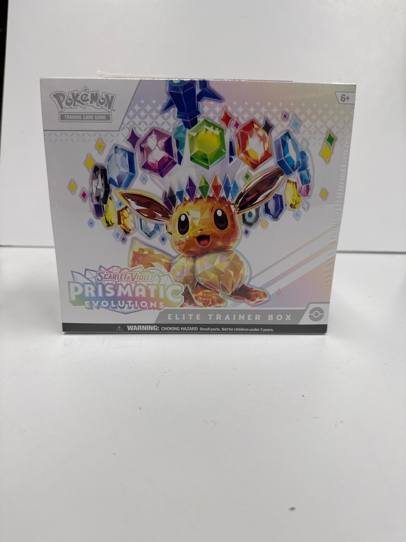Pokemon Scarlet & Violet Prismatic Evolutions Elite Trainer Box: This Pokemon TCG: Scarlet & Violet-Prismatic Evolutions Elite Trainer Box features a full-art foil promo card featuring Eevee, 45 TCG Energy cards, and a player's guide to the Scarlet & Violet-Prismat