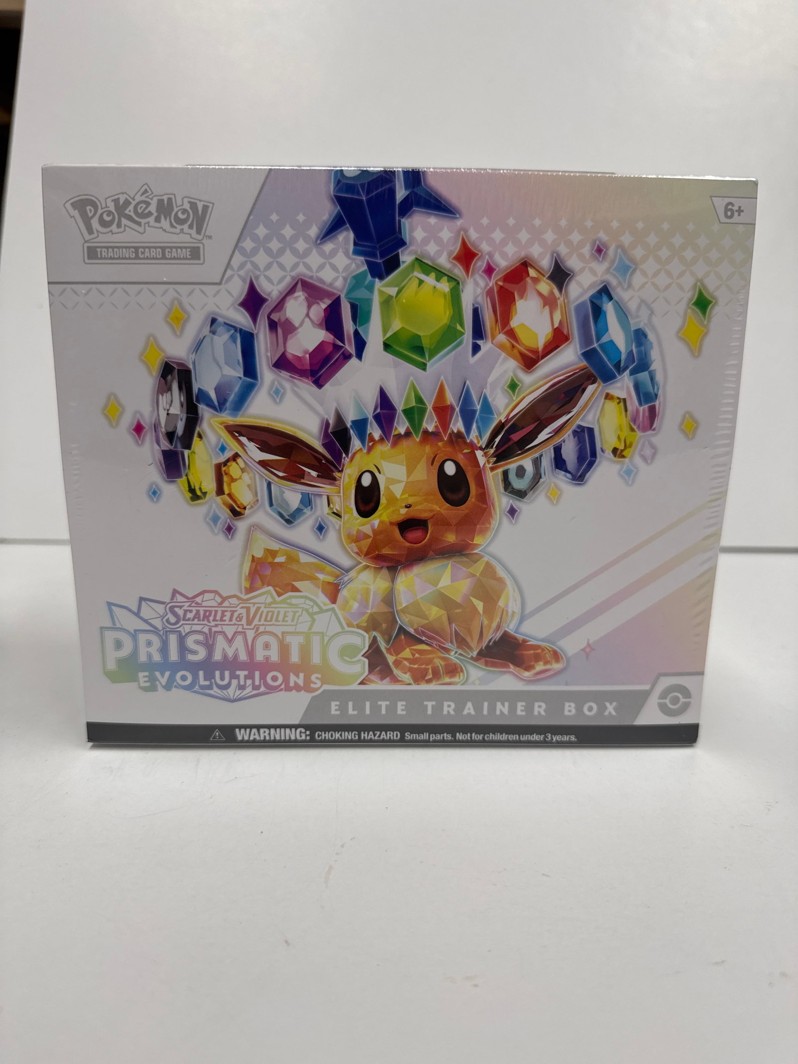 Pokemon Scarlet & Violet - Prismatic Evolutions Elite Trainer Box: Sealed Pokemon Trading Card Game Scarlet & Violet - Prismatic Evolutions Elite Trainer Box. Features Eevee and its evolutions, includes 9 booster packs, 65 card sleeves, energy cards, dice, and more.