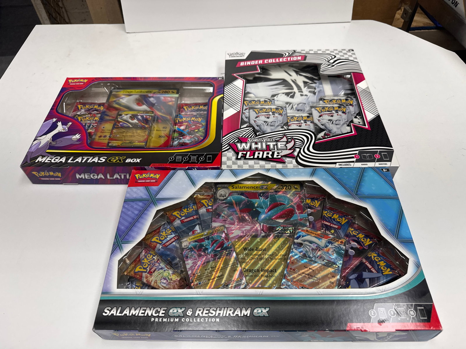 Pokemon TCG Mega Latias EX, Salamence EX & Reshiram EX Premium Collections: This lot includes three Pokemon Trading Card Game premium collections: Mega Latias EX Box, and Salamence EX & Reshiram EX Premium Collection. The Mega Latias EX box contains a full-art foil card and a