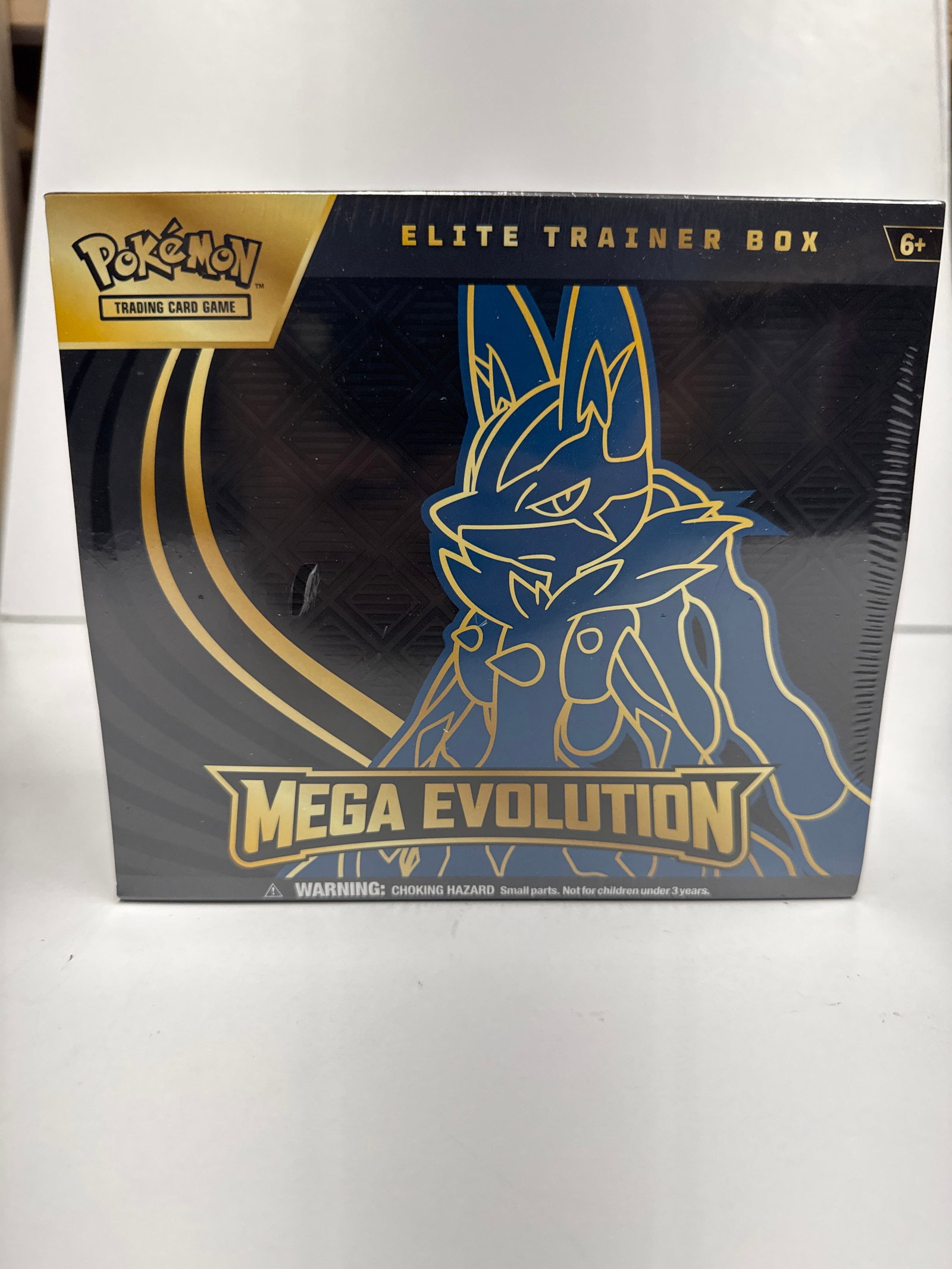 Pokemon Trading Card Game Mega Evolution Elite Trainer Box: Sealed Pokemon Trading Card Game Mega Evolution Elite Trainer Box. Features Mega Evolution artwork with Lucario. Includes 9 booster packs, sleeves, dice, and more.