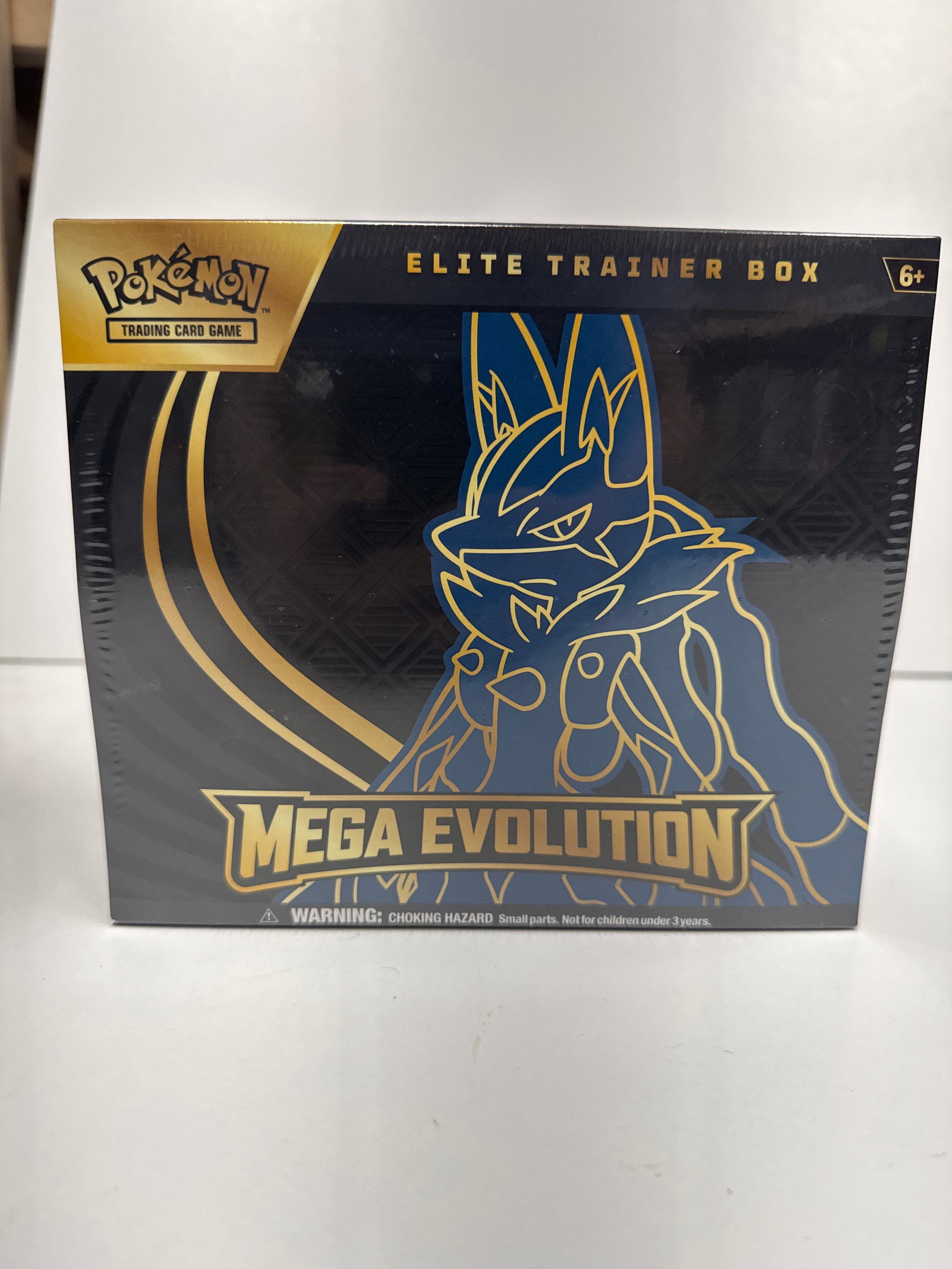 Pokemon Trading Card Game: Mega Evolution Elite Trainer Box: This sealed Pokemon Trading Card Game: Mega Evolution Elite Trainer Box includes 9 booster packs, 1 full-art promo card featuring Riolo, 65 card sleeves, 45 Pokemon TCG Energy cards, a player's guide 