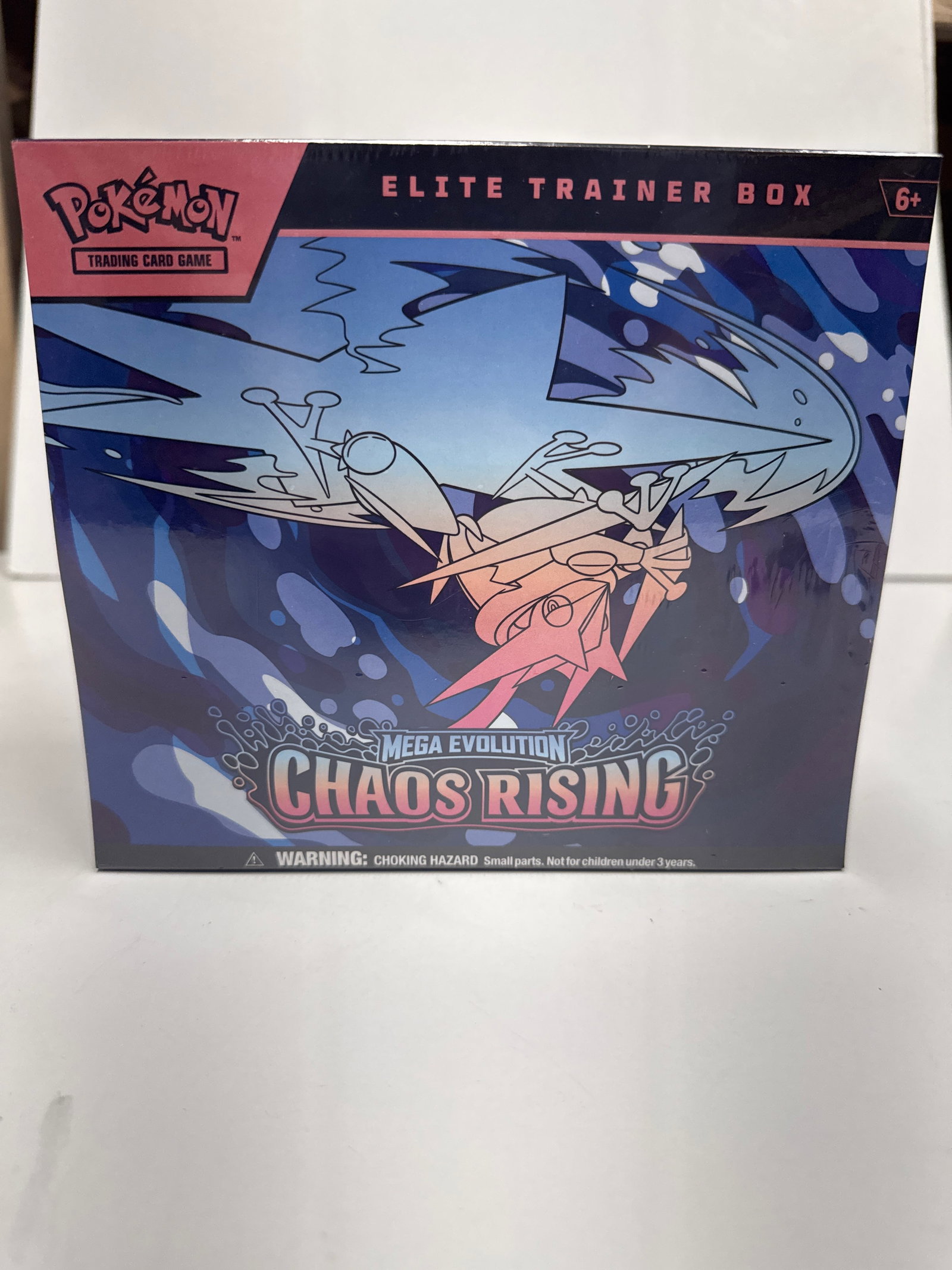 Pokemon TCG: Mega Evolution Chaos Rising Elite Trainer Box: This sealed Pokemon Trading Card Game Elite Trainer Box features the Mega Evolution Chaos Rising expansion. It includes 9 booster packs, a full-art promo card, energy cards, a player's guide, dice, da