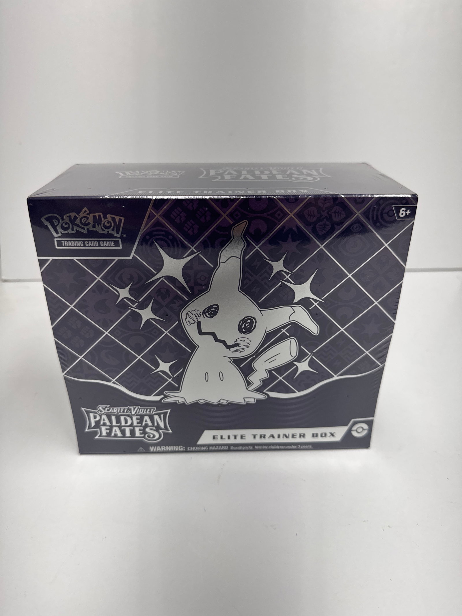 Pokemon Scarlet & Violet Paldean Fates Elite Trainer Box: Sealed Pokemon Scarlet & Violet Paldean Fates Elite Trainer Box. Features Mimikyu artwork and includes 10 booster packs, a full-art promo card, card sleeves, dice, and more.