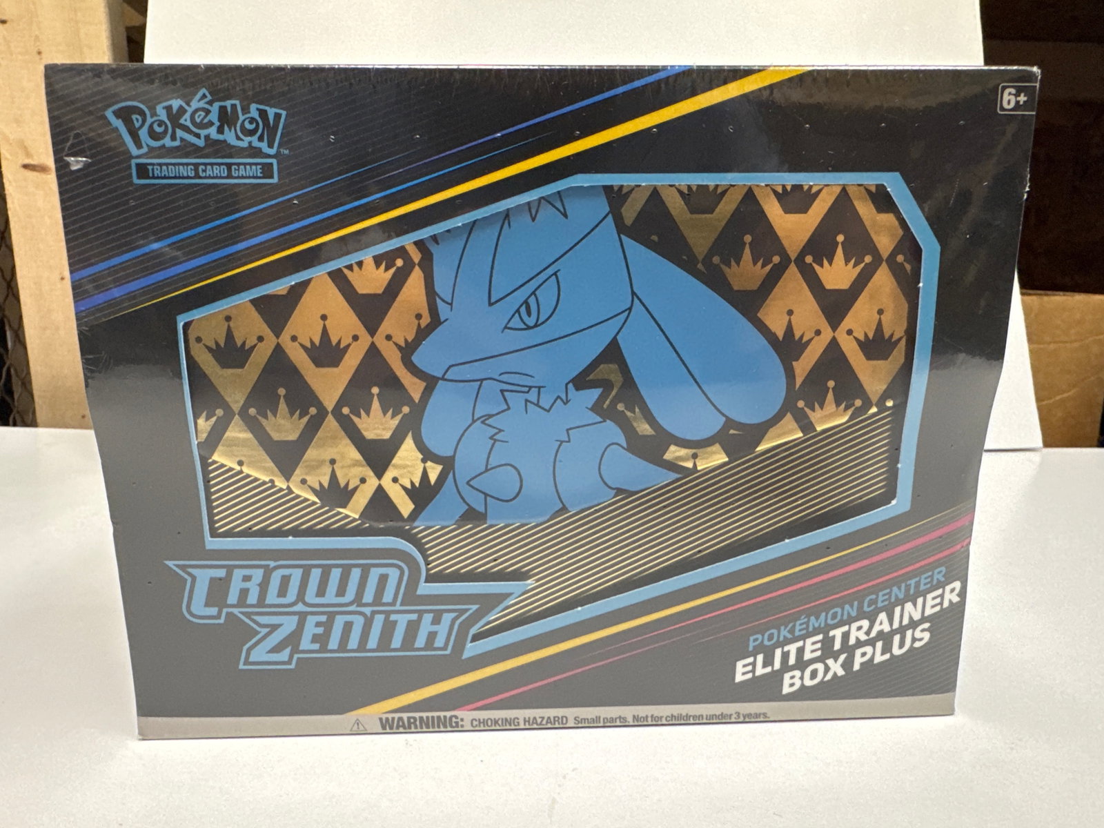 Pokemon TCG: Crown Zenith Pokemon Center Elite Trainer Box Plus: This is a sealed Pokemon TCG: Crown Zenith Elite Trainer Box Plus from Pokemon Center. It includes 12 booster packs, a Lucario VSTAR promo card, 65 card sleeves, a deck box, storage sleeves, a player'