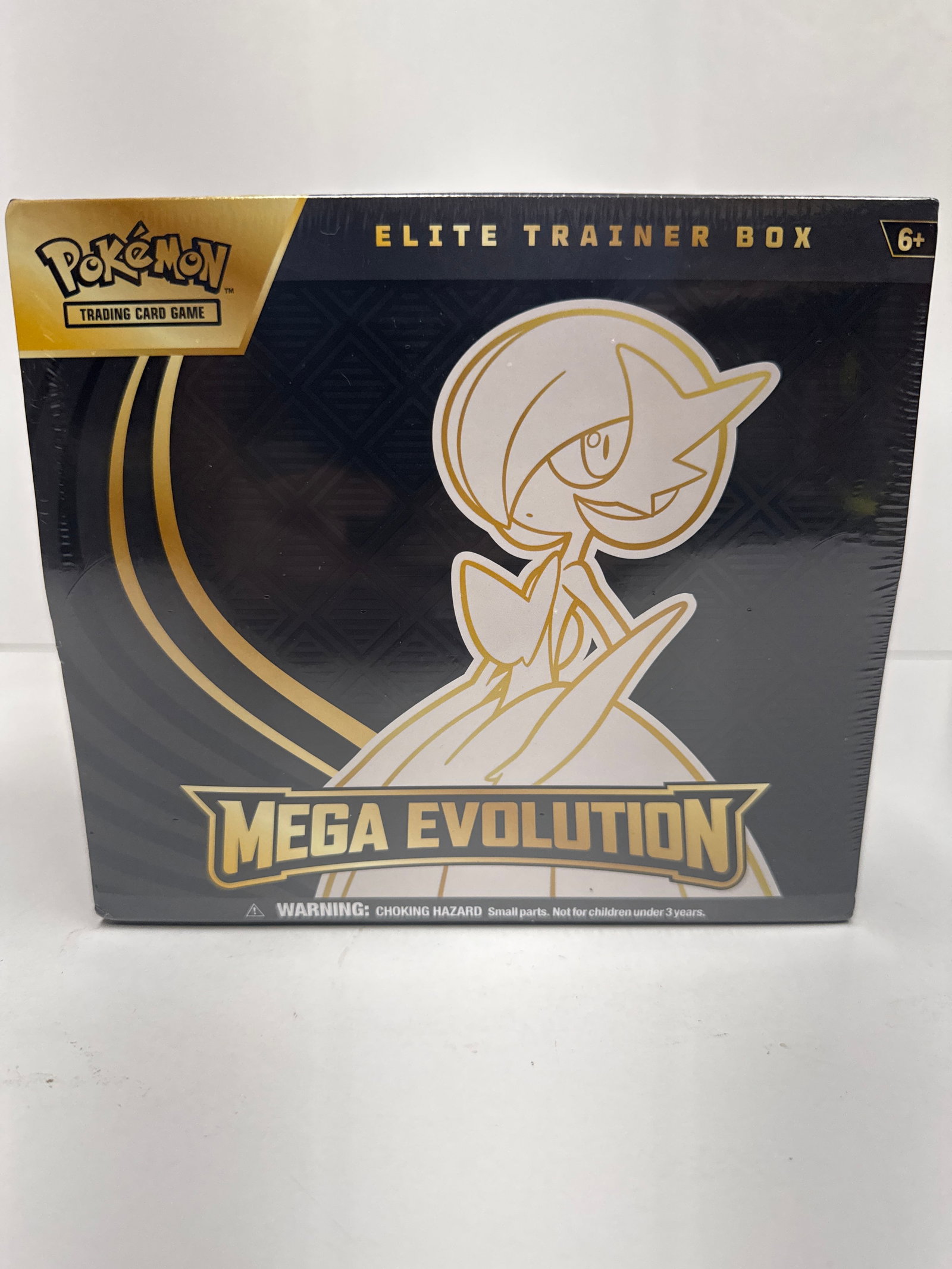Pokemon Trading Card Game Mega Evolution Elite Trainer Box: This is a sealed Pokemon Trading Card Game Mega Evolution Elite Trainer Box. It includes 9 Pokemon TCG booster packs, a full-art promo card featuring Alakazam, 65 card sleeves, 45 Energy cards, a play