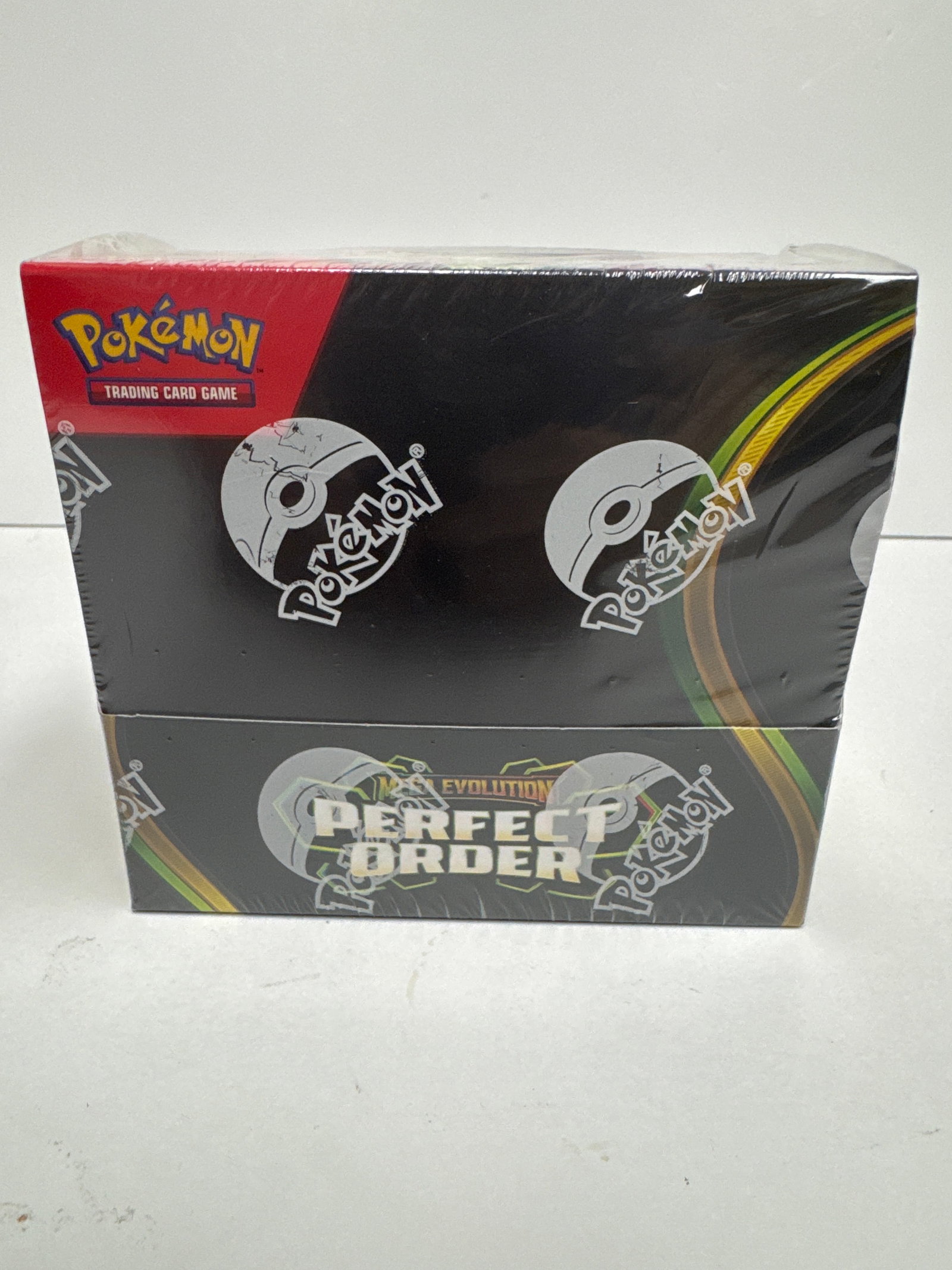 Pokemon TCG: Mega Evolutions - Perfect Order Elite Trainer Box: Sealed Pokemon Trading Card Game Elite Trainer Box from the Mega Evolutions - Perfect Order expansion. Features artwork with Mega Evolution Pokemon and includes various game accessories.