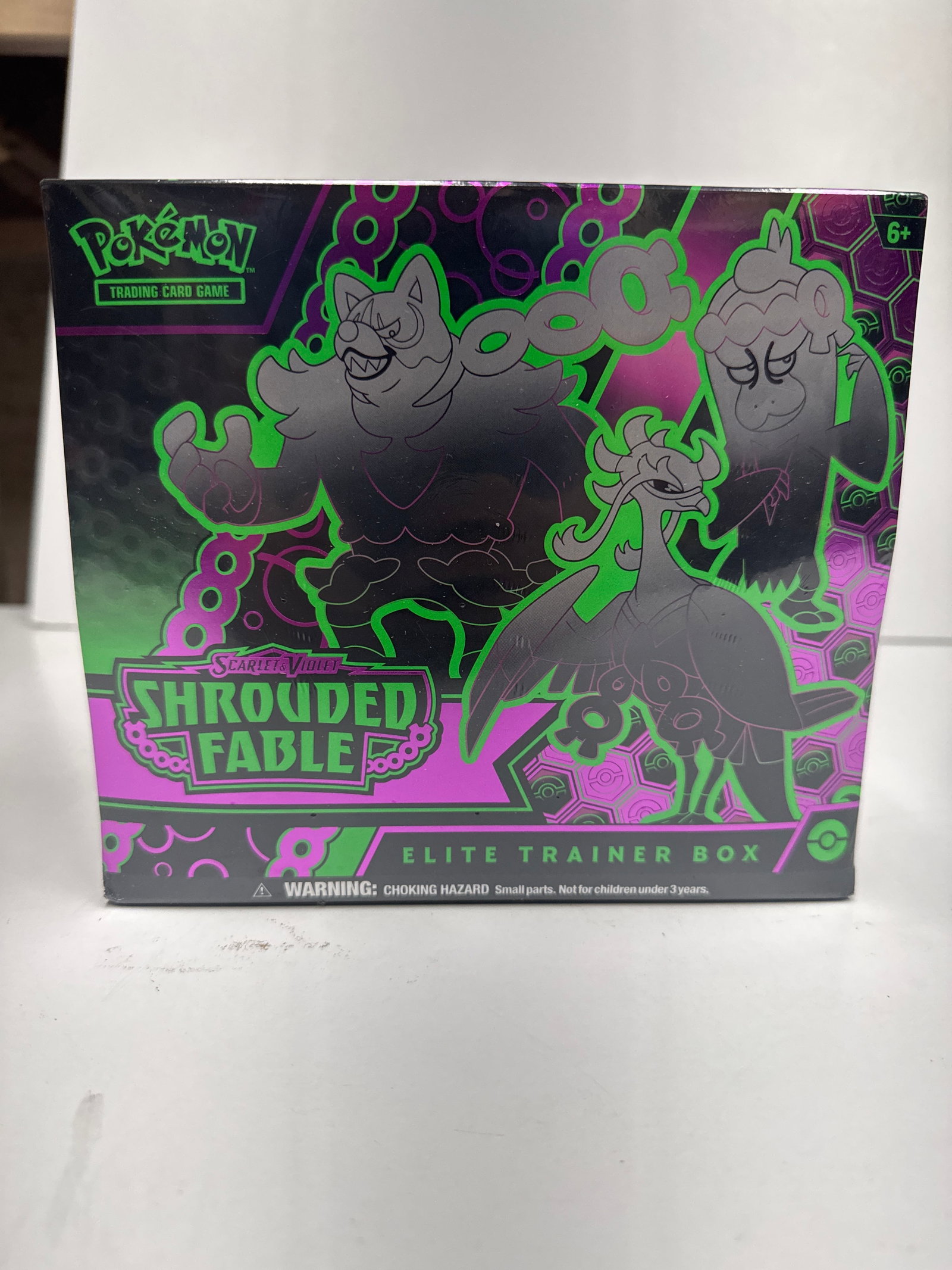 Pokemon Scarlet & Violet Shrouded Fable Elite Trainer Box: Sealed Pokemon TCG Scarlet & Violet - Shrouded Fable Elite Trainer Box. Contains 9 booster packs, a full-art promo card, sleeves, dice, and more.