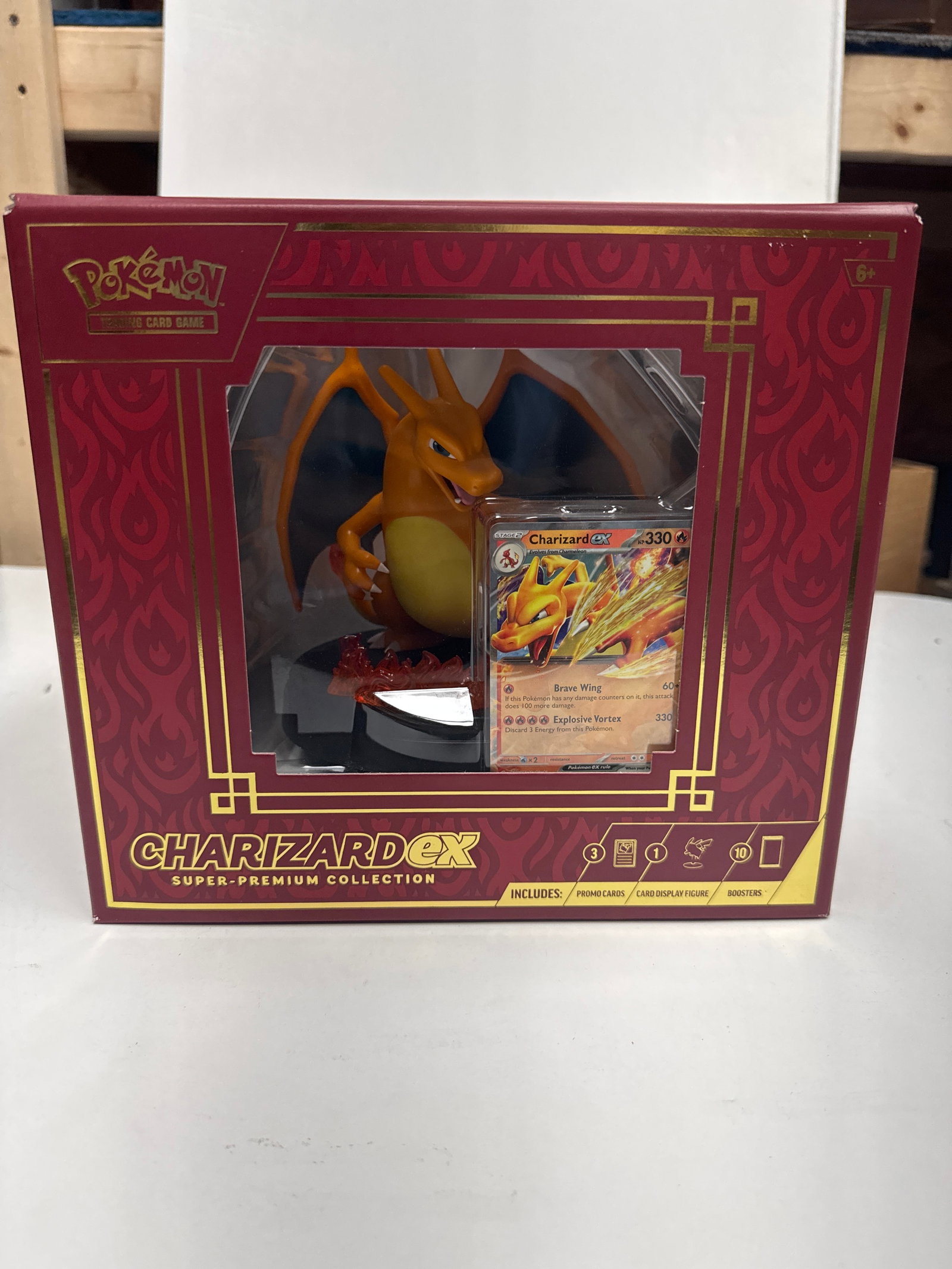 Pokemon TCG Charizard EX Super-Premium Collection Box: This Pokemon TCG Charizard EX Super-Premium Collection includes: 1 foil promo card featuring Charizard EX, 2 foil cards featuring Charmander and Charmeleon, 1 card-display figure featuring Charizard, 