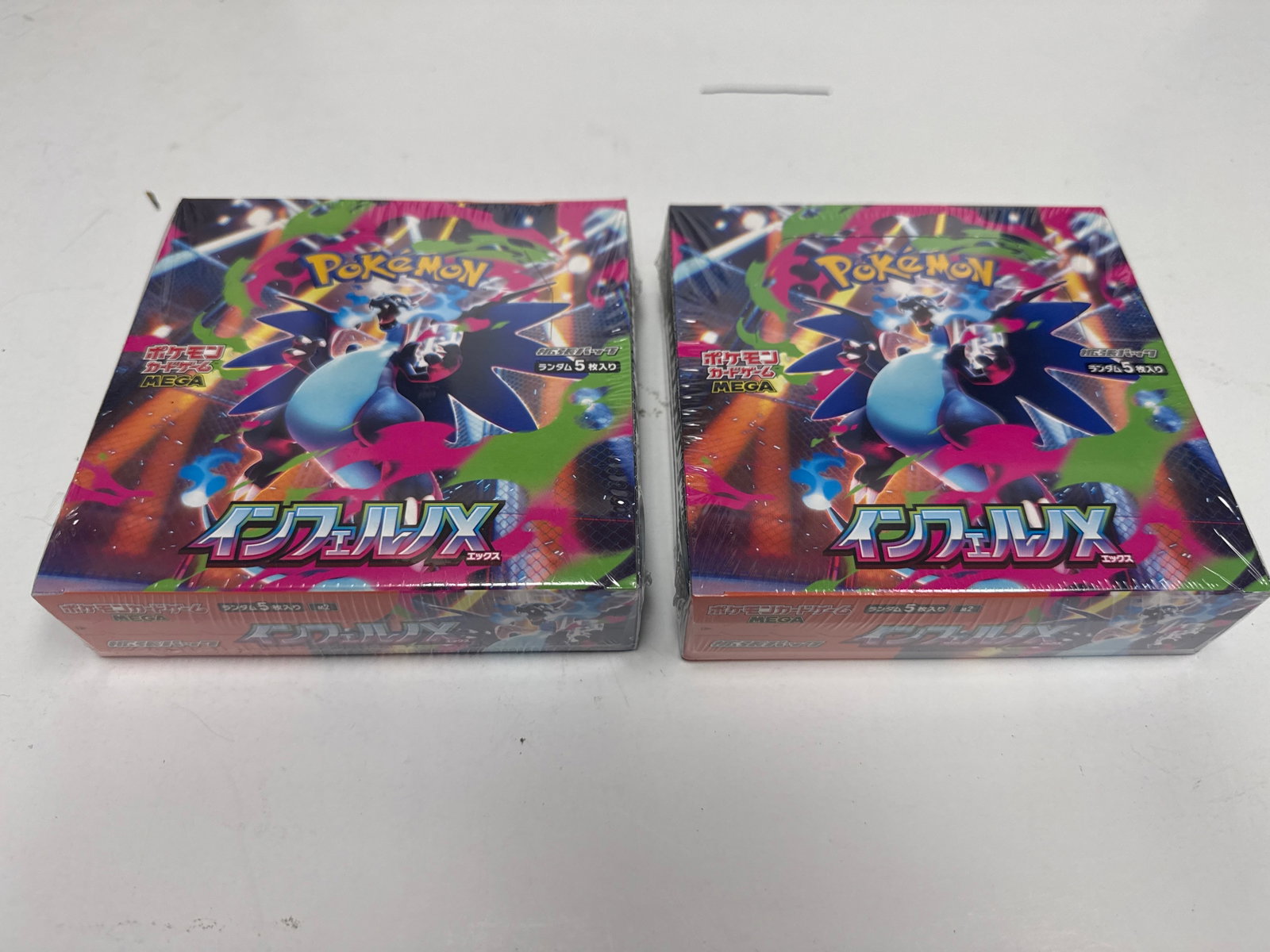 Two Sealed Pokemon TCG Sword & Shield "Infinity Zone" Booster Boxes: This lot features two brand new, factory-sealed booster boxes from the Pokemon Trading Card Game's "Infinity Zone" set (S-5a). Each box contains 30 packs, with each pack holding 5 cards. These boxes a