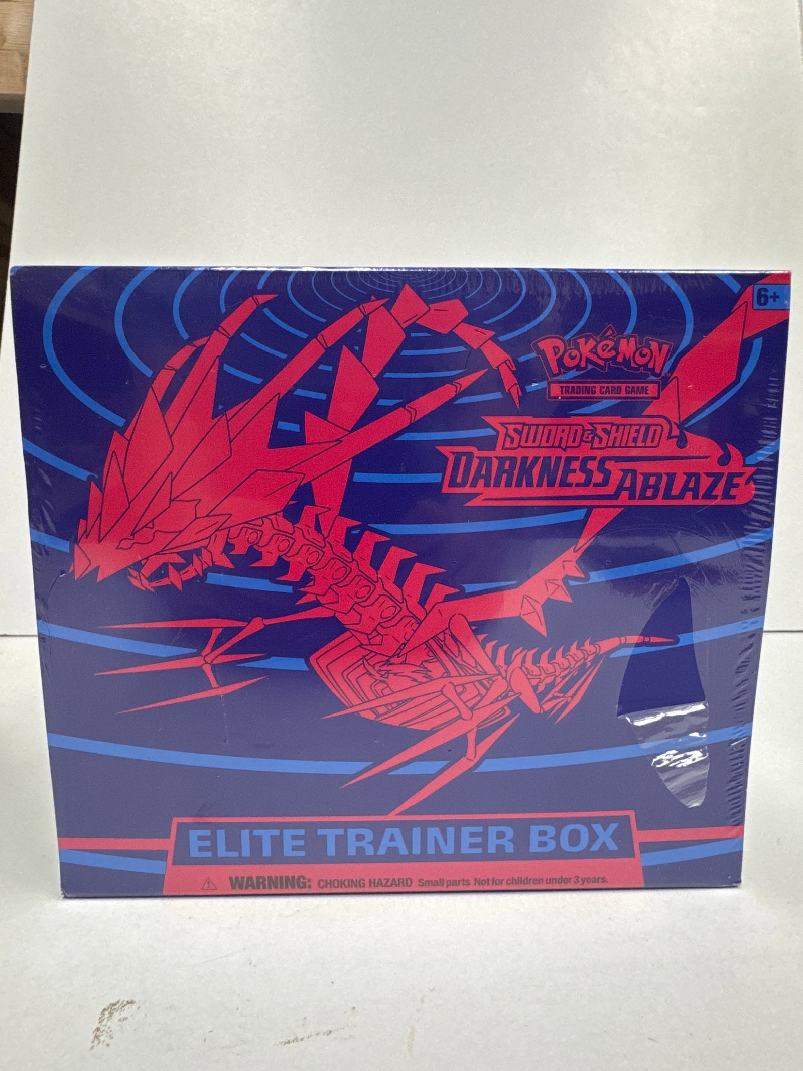 Pokemon Sword & Shield Darkness Ablaze Elite Trainer Box: Sealed Pokemon Sword & Shield Darkness Ablaze Elite Trainer Box. Features 10 Sword & Shield-Darkness Ablaze booster packs, 65 card sleeves featuring Eternatus, 45 Energy cards, a player's guide, damag