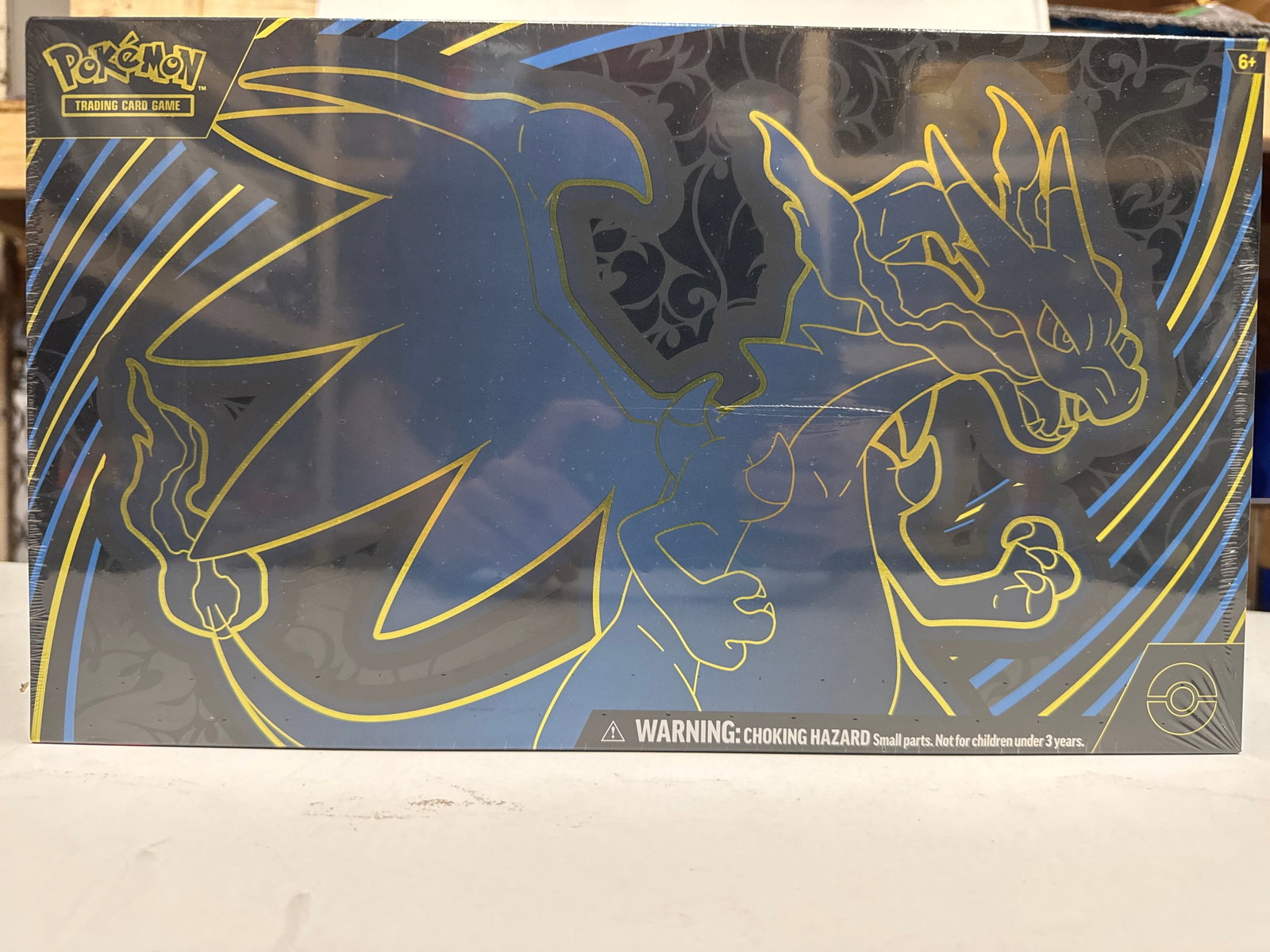 Pokemon TCG Mega Charizard X Ultra-Premium Collection Box: This Pokemon TCG Ultra-Premium Collection features Mega Charizard X. It includes 1 foil promo card featuring Mega Charizard X, 1 foil promo card featuring ORICORIO, 65 card sleeves, 1 playmat, 1 deck 