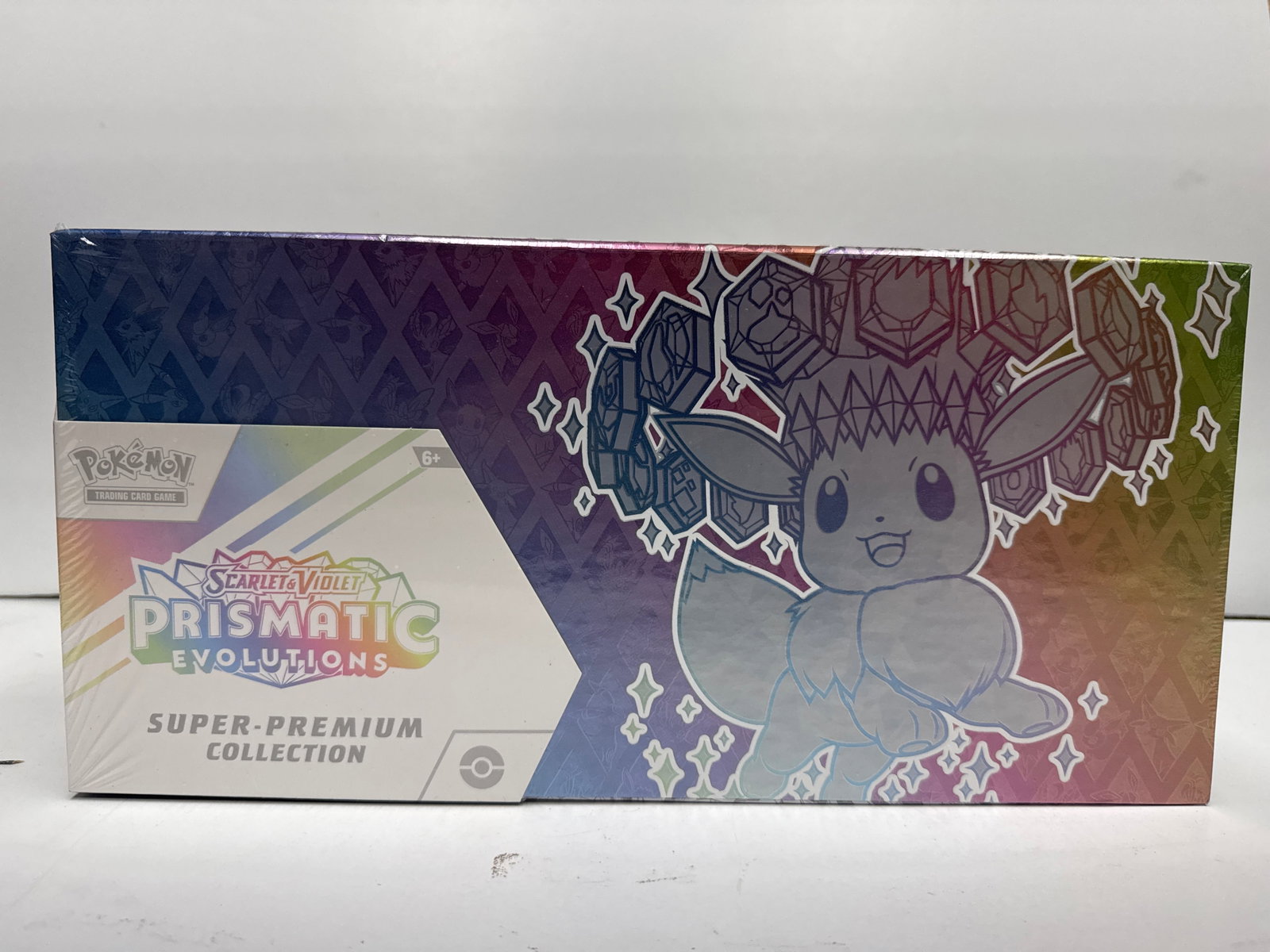 Pokemon TCG Scarlet & Violet Prismatic Evolutions Eevee & Friends Super-Premium Collection Box: Sealed Pokemon TCG Scarlet & Violet Prismatic Evolutions Eevee & Friends Super-Premium Collection Box. Includes 1 full-art promo card featuring Eevee ex, 1 playmat, 1 fuzzy Eevee deck box, 1 playmat, 