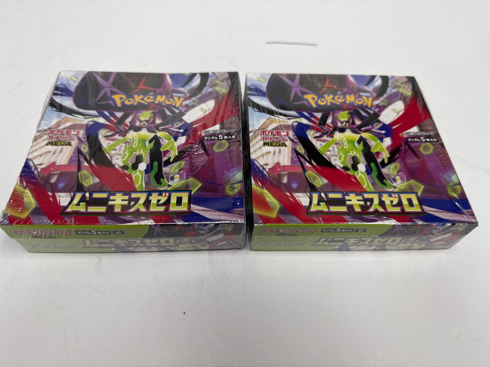 Two Pokemon TCG Sword & Shield Infinity Zone Set Booster Boxes: This lot features two sealed booster boxes of the Pokemon Card Game Sword & Shield expansion pack, titled "Infinity Zone" (Japanese: "Mugen Zone"). Each box contains 30 packs, 