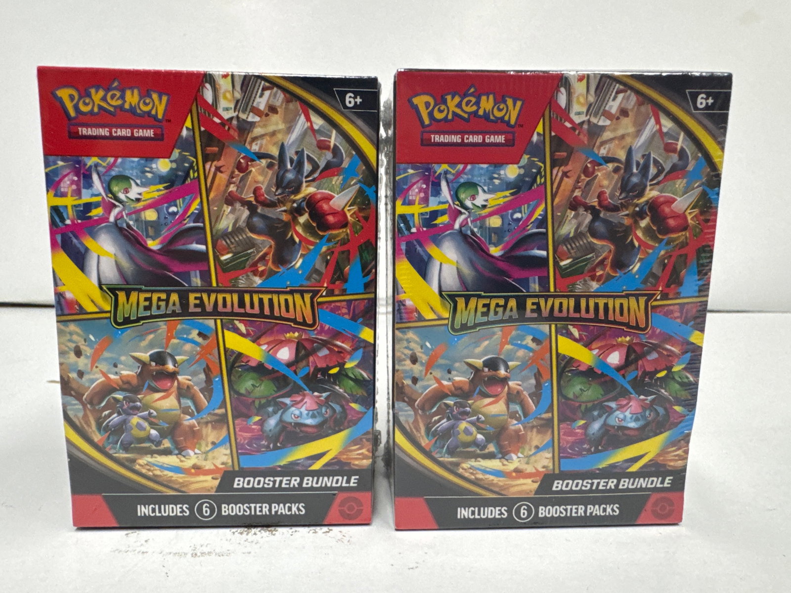 Pokemon TCG: Mega Evolution Booster Bundle (2 Packs): Two sealed Pokemon TCG: Mega Evolution Booster Bundles. Each bundle contains six booster packs, totaling twelve packs. Features popular Pokemon like Mega Lucario ex and Mega Gardevoir ex.