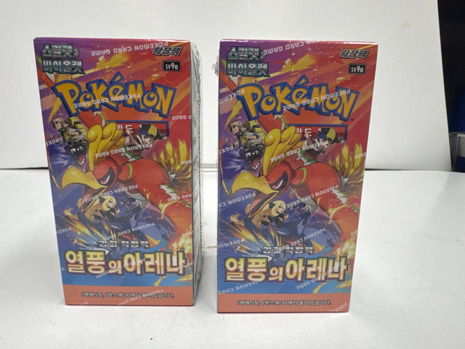 Pokemon Card Game - Korean Version - 1st Edition Booster Boxes (2): Two sealed 1st edition booster boxes for the Pokemon Card Game, Korean version. The boxes feature artwork from the 'Frozen's Arena' set. Each box contains 30 booster packs.