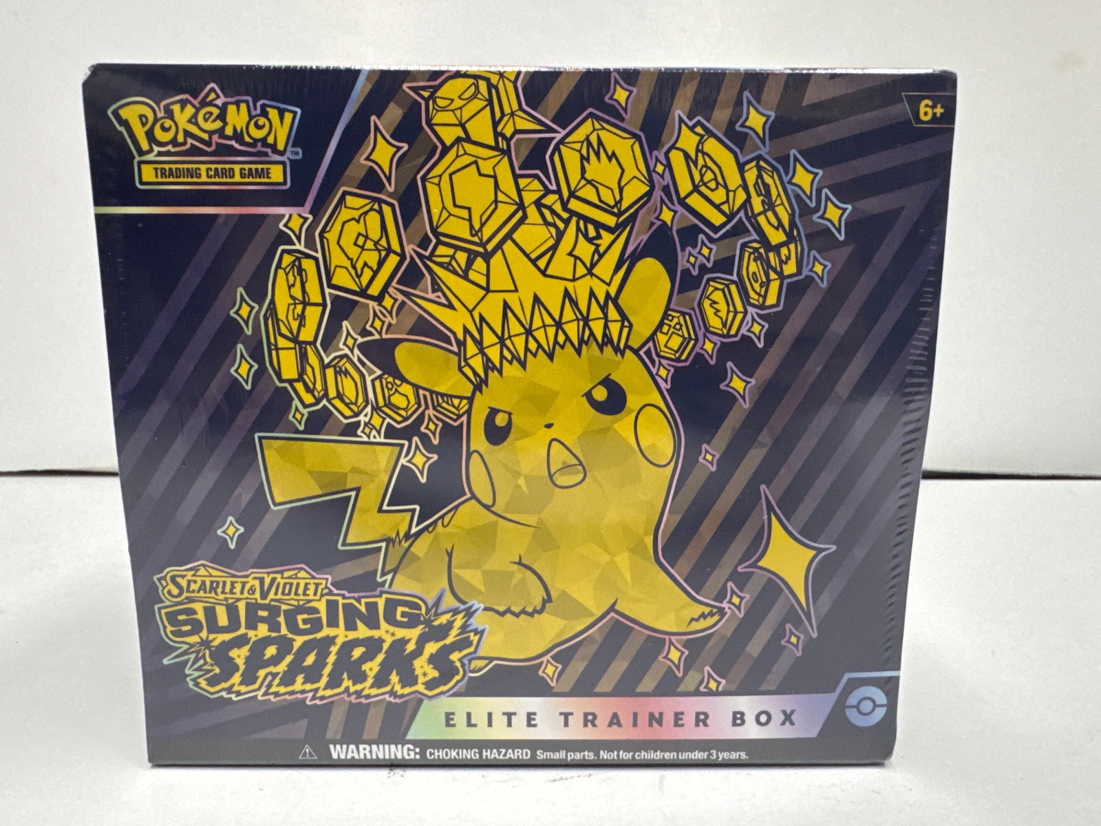Pokemon TCG Scarlet & Violet: Surging Sparks Elite Trainer Box: Sealed Elite Trainer Box for the Pokemon Trading Card Game, Scarlet & Violet: Surging Sparks expansion. Features Pikachu artwork and includes 9 booster packs, 1 full-art promo card, 65 card sleeves, a