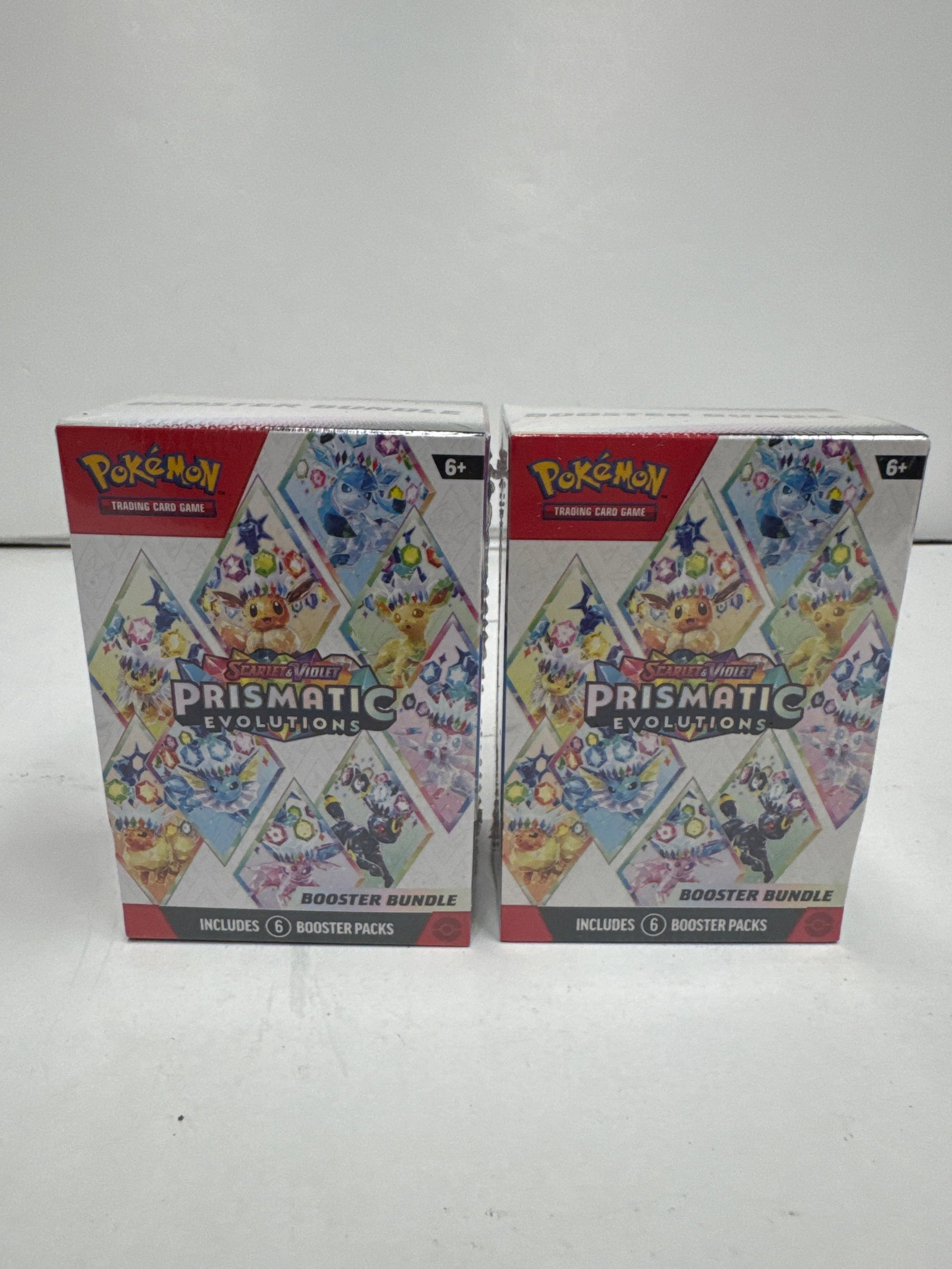 Pokemon TCG Scarlet & Violet: Prismatic Evolutions Booster Bundle (2x Boxes): This lot includes two (2) Pokemon TCG Scarlet & Violet: Prismatic Evolutions Booster Bundles. Each bundle contains six (6) booster packs, featuring over 175 cards, new PokÃ©mon ex, and a full-art ra