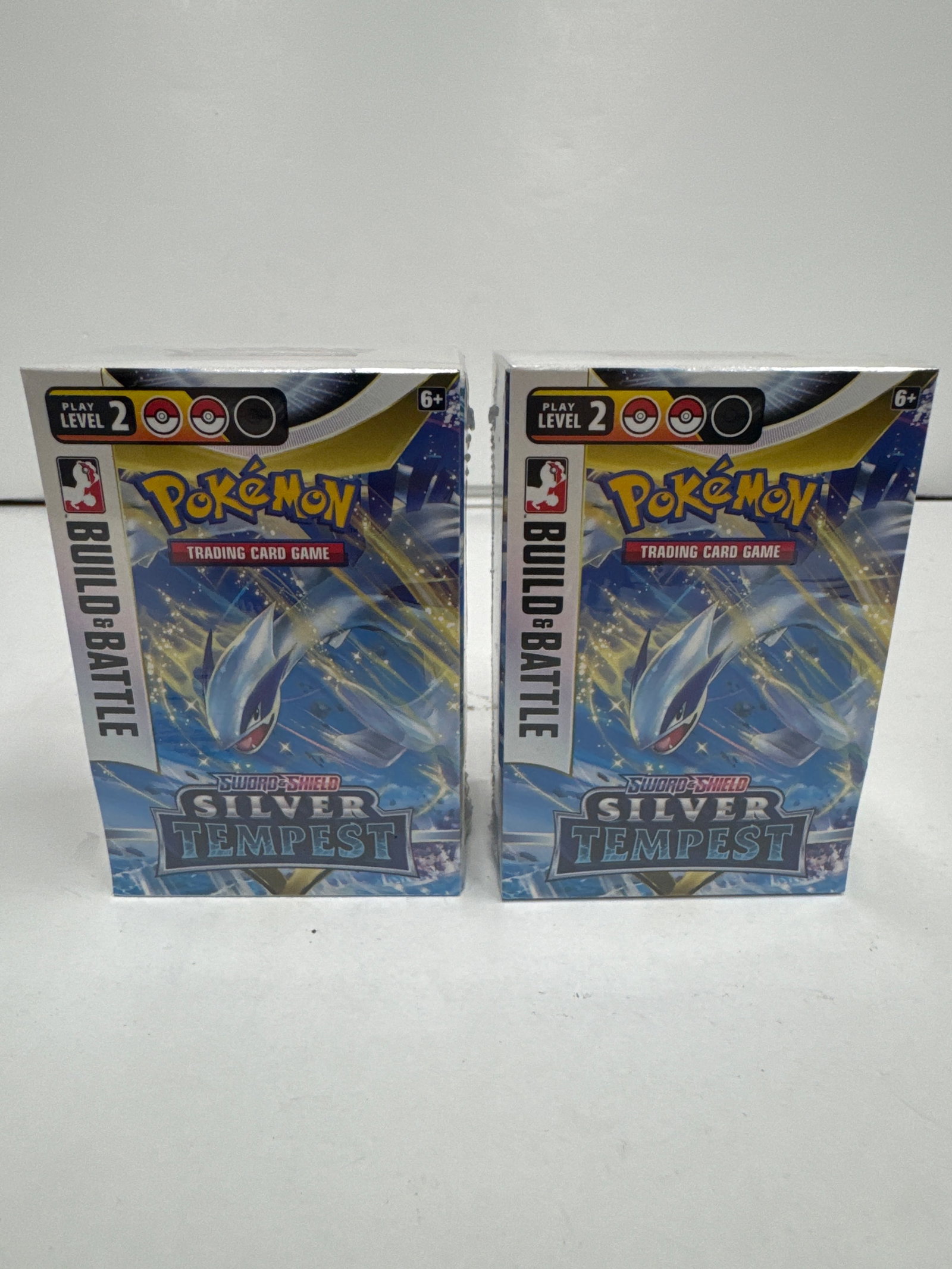 Two Pokemon TCG Sword & Shield Silver Tempest Build & Battle Boxes: This lot includes two Pokemon Trading Card Game (TCG) Sword & Shield Silver Tempest Build & Battle Boxes. Each box contains a 40-card ready-to-play deck, one of four unique foil promo cards, four Poke