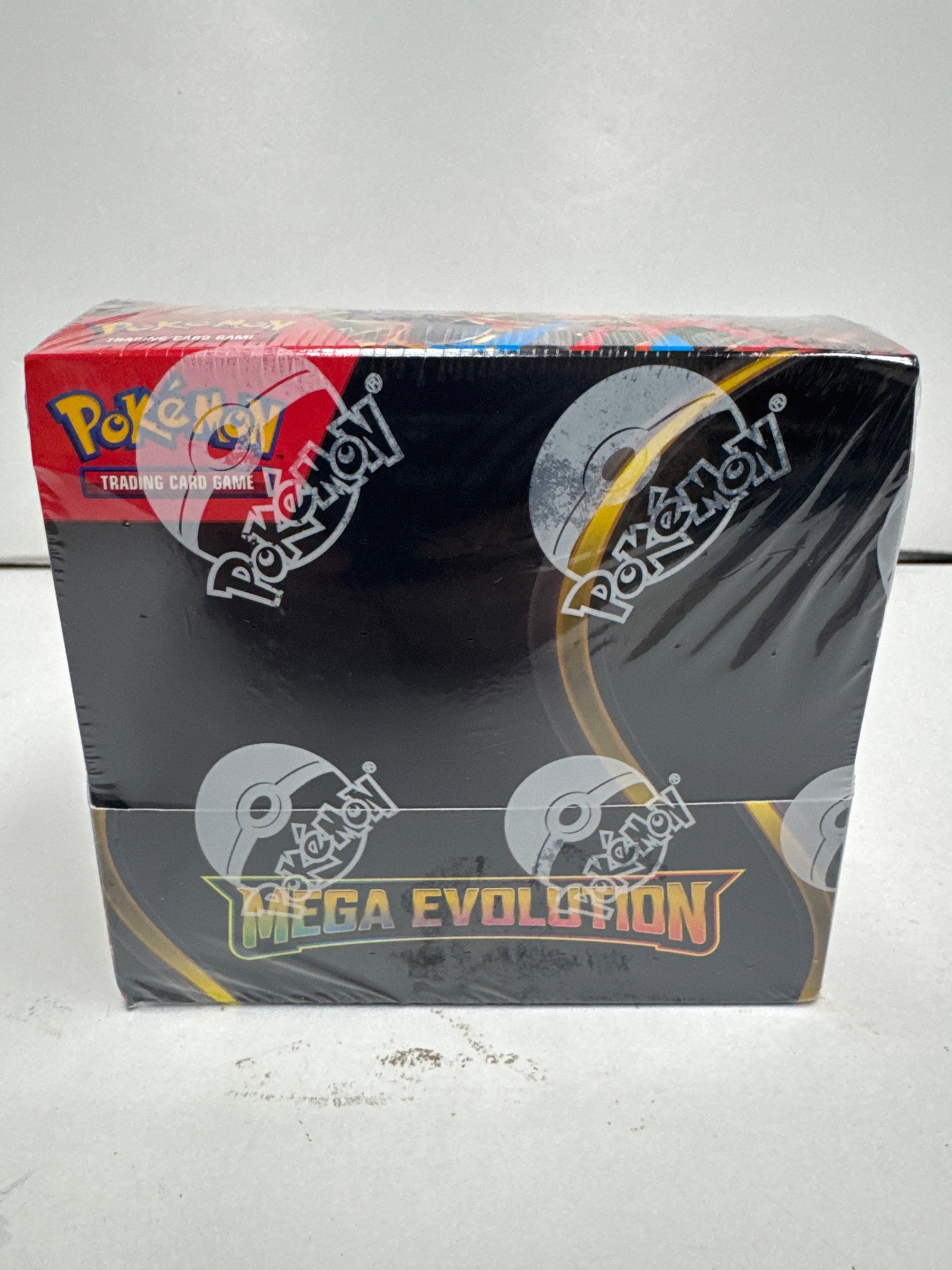 Pokemon TCG Mega Evolution Booster Box: Sealed Pokemon Trading Card Game Mega Evolution Booster Box. This expansion contains over 100 cards, featuring Mega Evolution Pokemon and powerful Trainer cards. The box is sealed and in good conditio