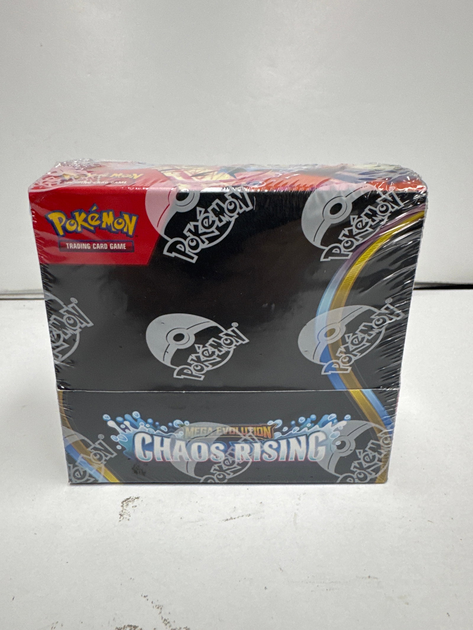 Pokemon TCG: Mega Evolution Chaos Rising Booster Box: Sealed booster box for the Pokemon Trading Card Game, featuring the Mega Evolution - Chaos Rising expansion. This box contains multiple booster packs, promising exciting new cards and strategies for c