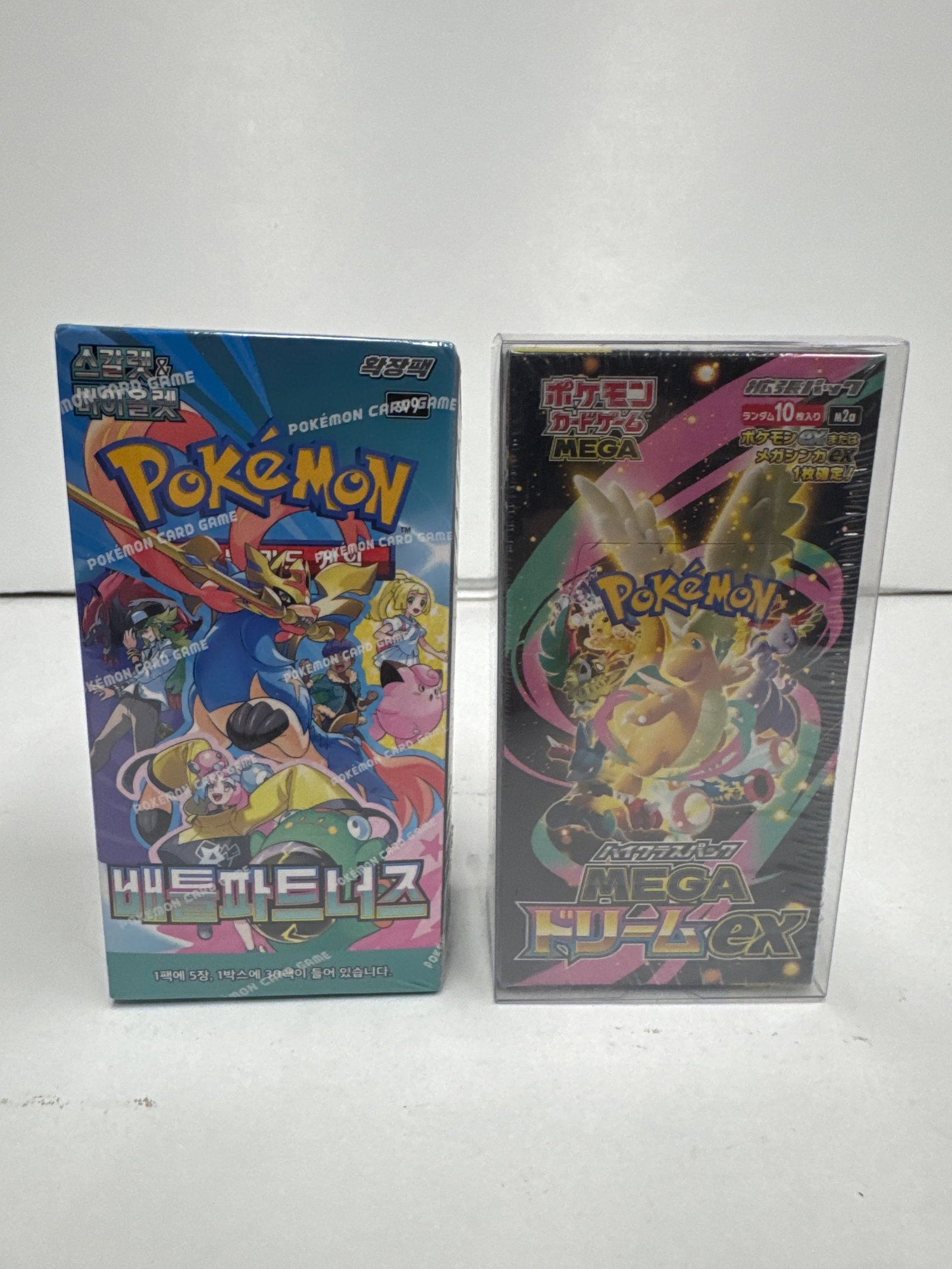 Two Sealed Pokemon Card Game Booster Boxes: Mega Top Deck EX and Battle Style: This lot features two sealed Pokemon Card Game booster boxes. The first is the "Battle Style" set from Sword & Shield, a Korean release. The second is a Japanese Mega Top Deck EX set, fe