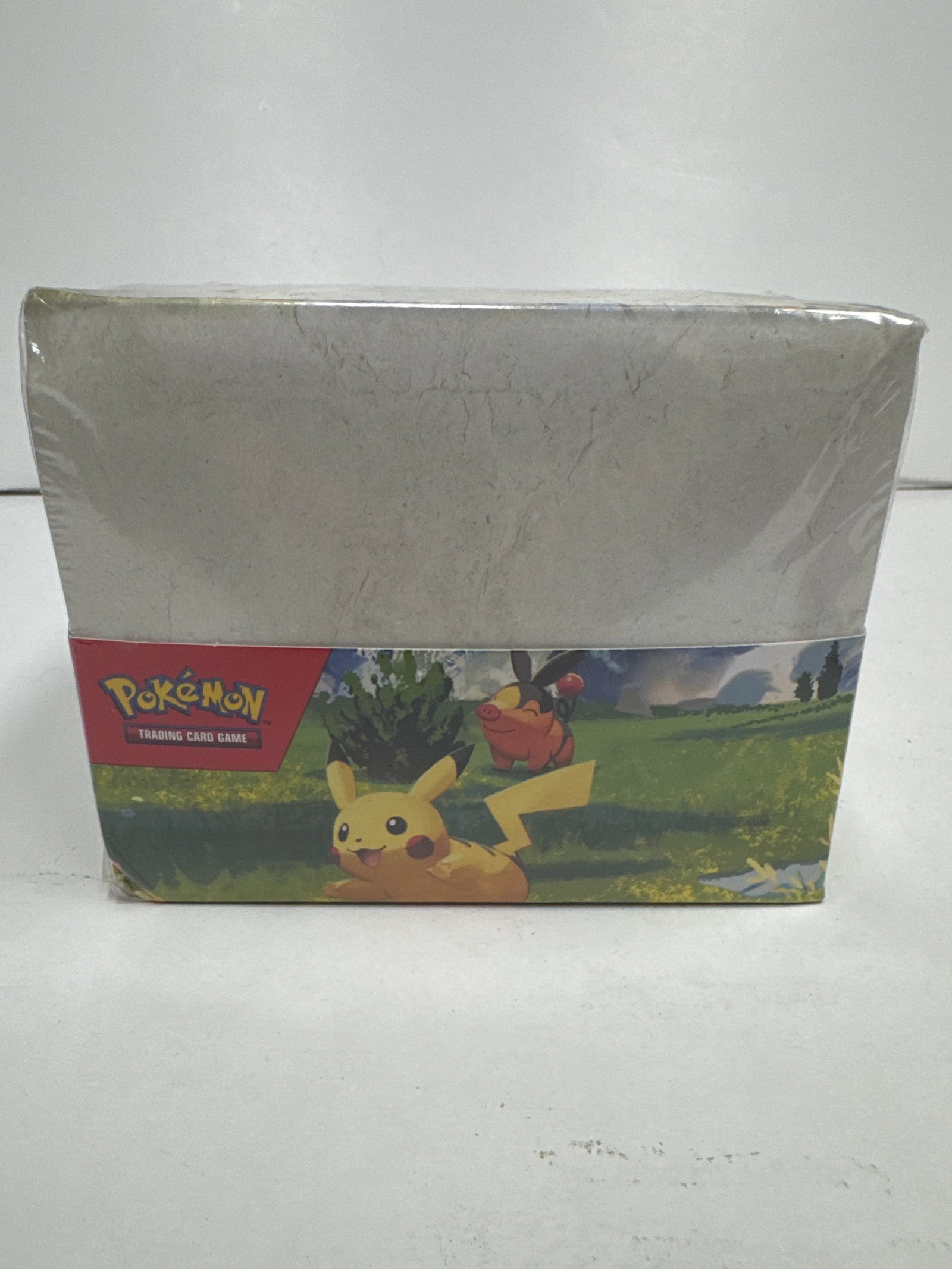 Pokemon Trading Card Game Ascended Heroes Mini Tin Box: Sealed Pokemon Trading Card Ascended Heroes Mini Tin box featuring various Pokemon characters like Pikachu, Riolu, Clefairy, and more. The box is shrink-wrapped and appears to be in good condition.