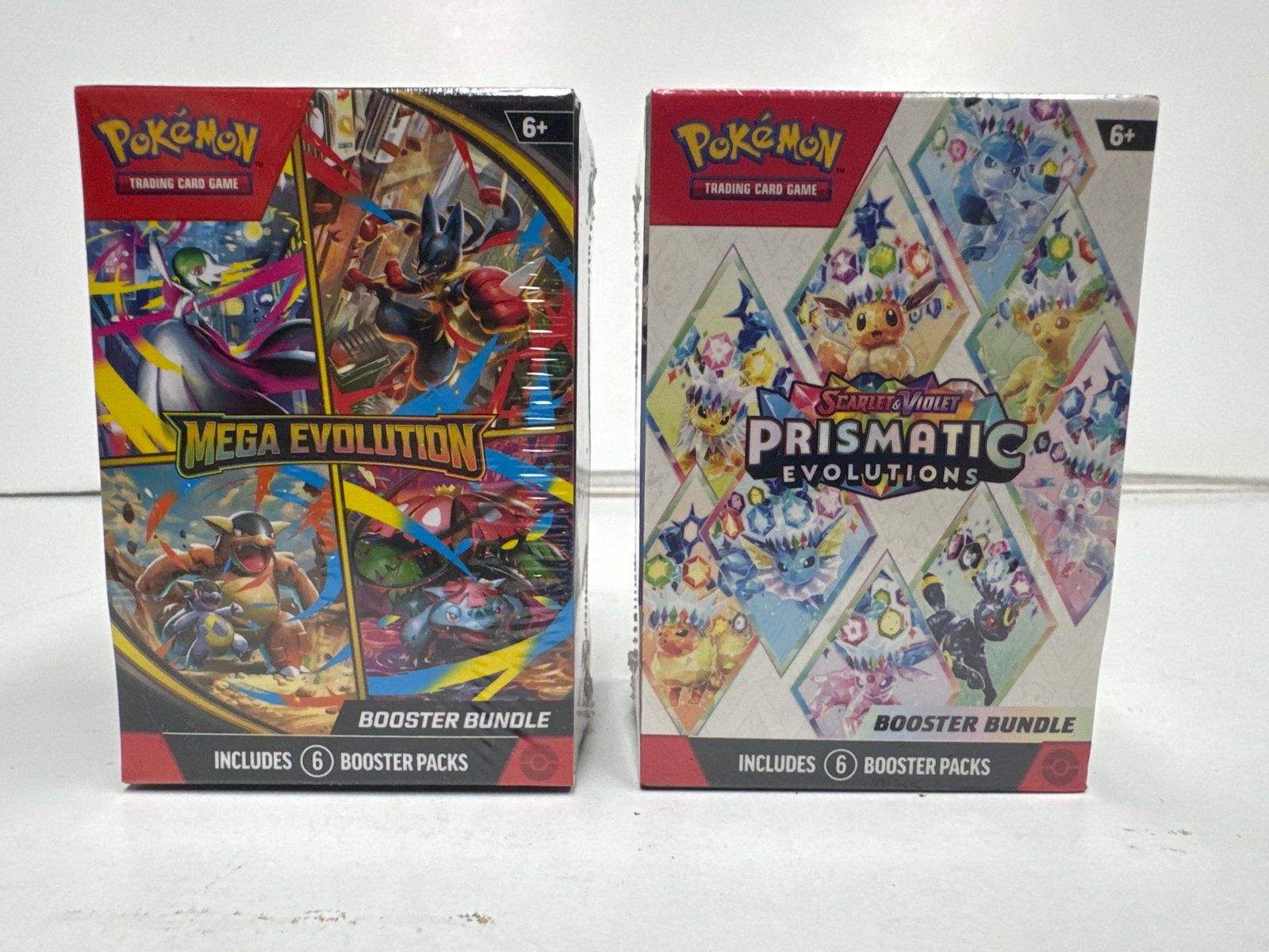 Pokemon TCG Booster Bundle Lot: Mega Evolution & Scarlet & Violet Prismatic Evolutions: This lot includes two Pokemon Trading Card Game Booster Bundles. The first is the Mega Evolution expansion, featuring over 180 cards. The second is the Scarlet & Violet Prismatic Evolutions expansion,