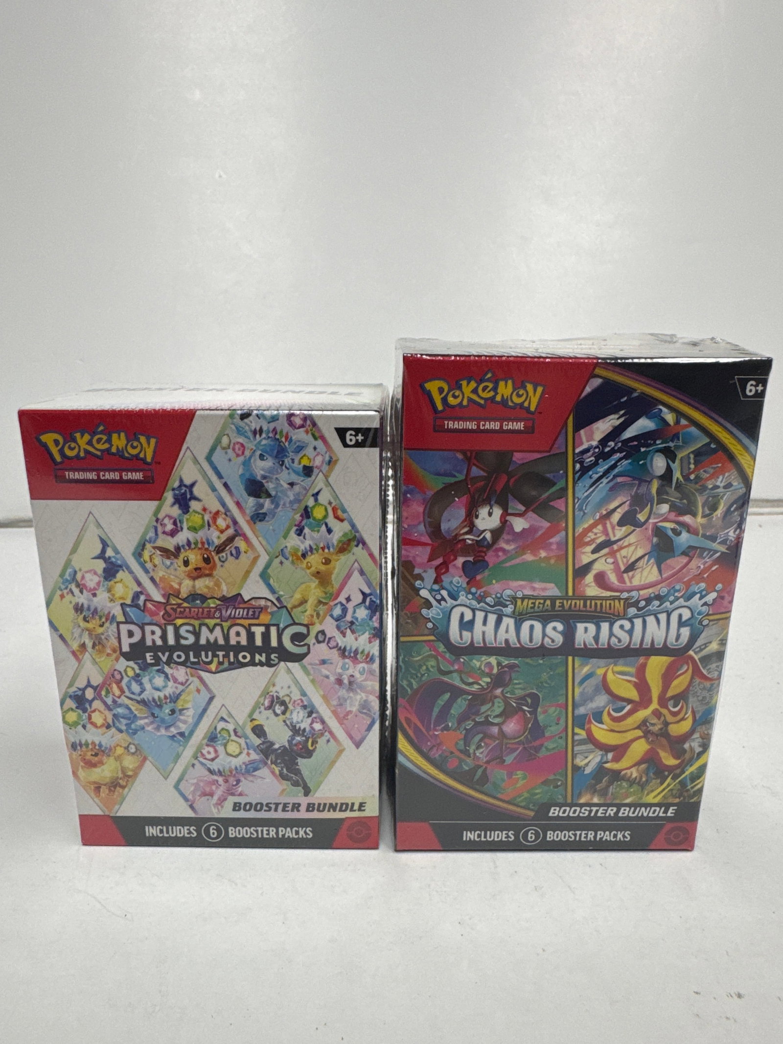 Pokemon TCG Scarlet & Violet Prismatic Evolutions & Mega Evolution Chaos Rising Booster Bundles: Two Pokemon TCG Booster Bundles: Scarlet & Violet - Prismatic Evolutions and Mega Evolution - Chaos Rising. Each bundle includes 6 booster packs, offering a chance to collect a wide array of Pokemon c