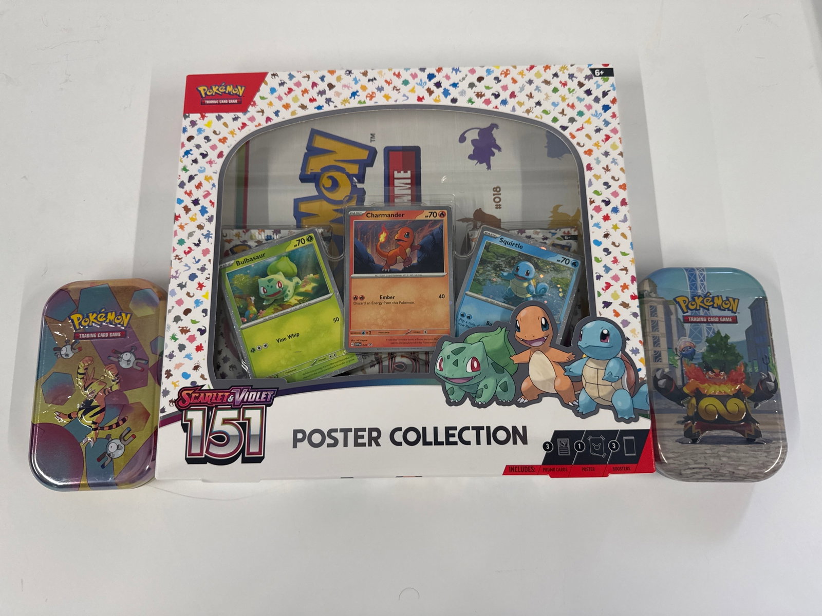 Pokemon Scarlet & Violet 151 Poster Collection & 2 Mini Tins: This Pokemon Scarlet & Violet 151 Poster Collection includes promo cards featuring Bulbasaur, Charmander, and Squirtle, along with a poster and booster packs. The set also comes with two