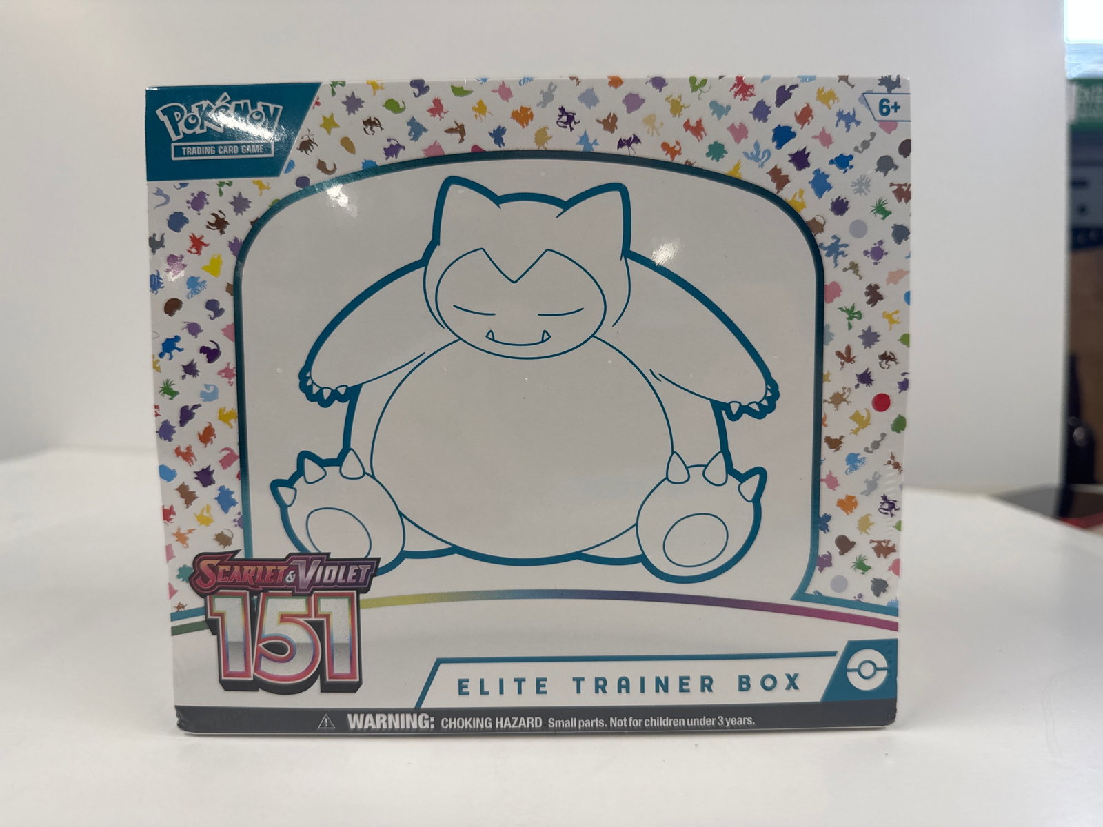 Pokemon Scarlet & Violet 151 Elite Trainer Box: Sealed Pokemon Scarlet & Violet 151 Elite Trainer Box. This box includes 9 booster packs, 65 card sleeves featuring Snorlax, 45 TCG energy cards, a player's guide, damage-counter dice, and a code