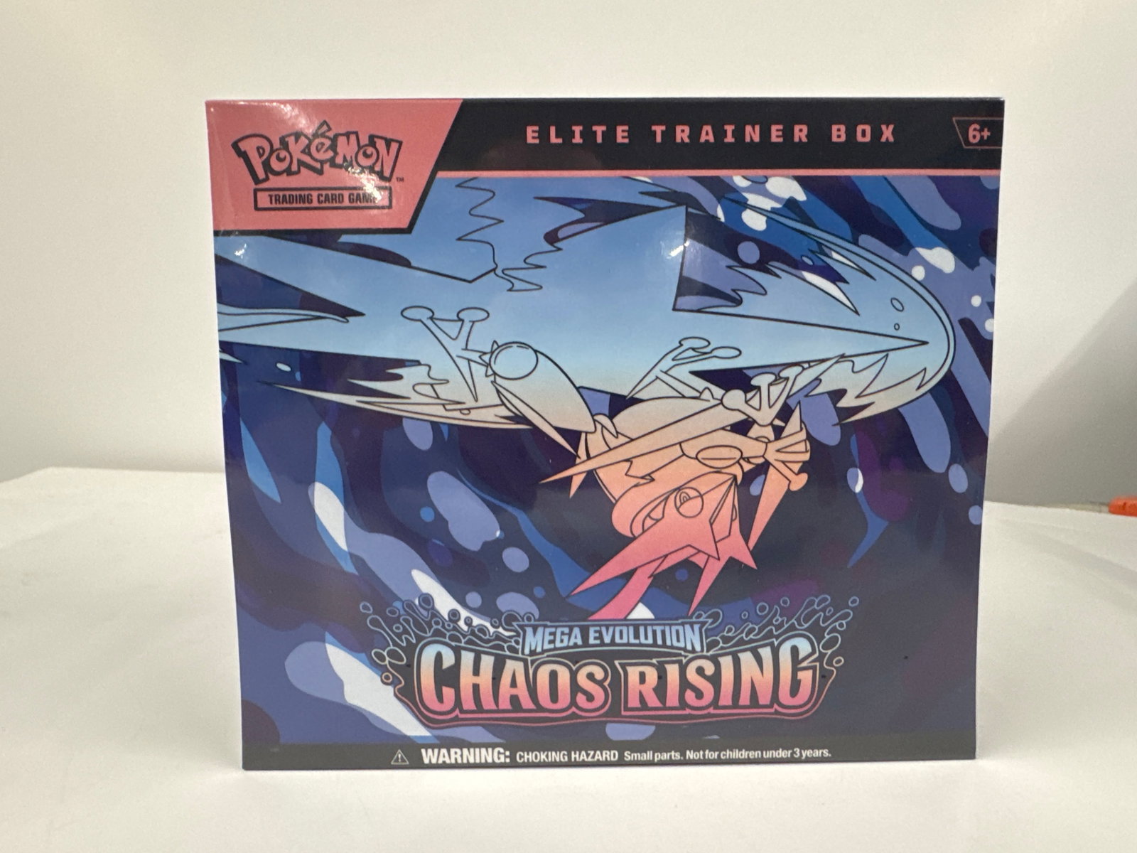 Pokemon TCG: Mega Evolution Chaos Rising Elite Trainer Box: This Pokemon TCG: Mega Evolution-Chaos Rising Elite Trainer Box includes 9 booster packs, a full-art promo card featuring Fennekin, 65 card sleeves, 40 TCG Energy cards, a player's guide, damage-count