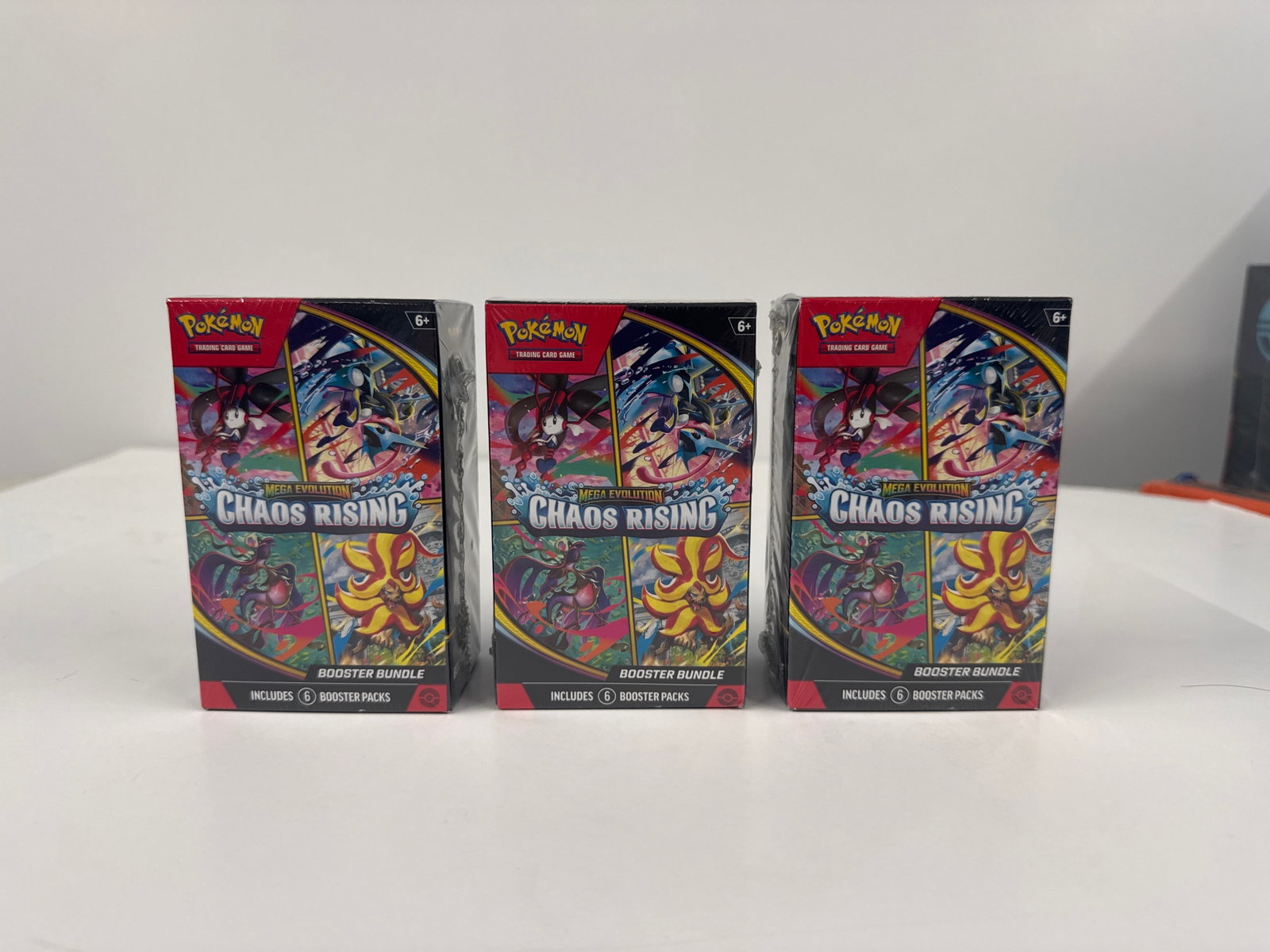 Pokemon TCG: Mega Evolution Chaos Rising Booster Bundle (3-Pack): Three sealed Pokemon TCG: Mega Evolution Chaos Rising Booster Bundles. Each bundle contains 6 booster packs, offering a total of 18 packs for collectors and players.