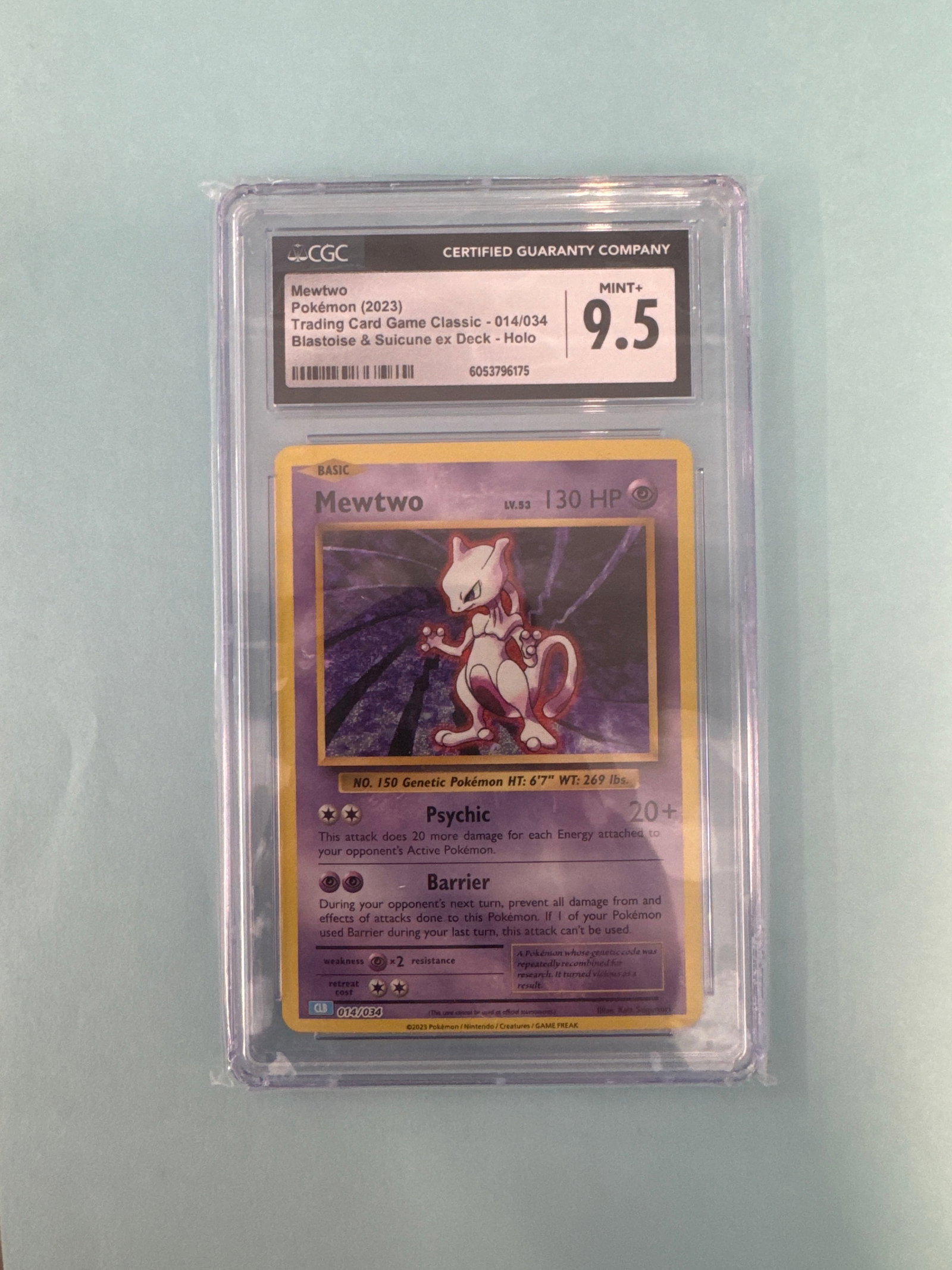 CGC 9.5 Mewtwo Pokemon Card: Mewtwo Pokemon card. Graded CGC 9.5 and encased in a protective holder. Size: 12 x 8cm approx. 