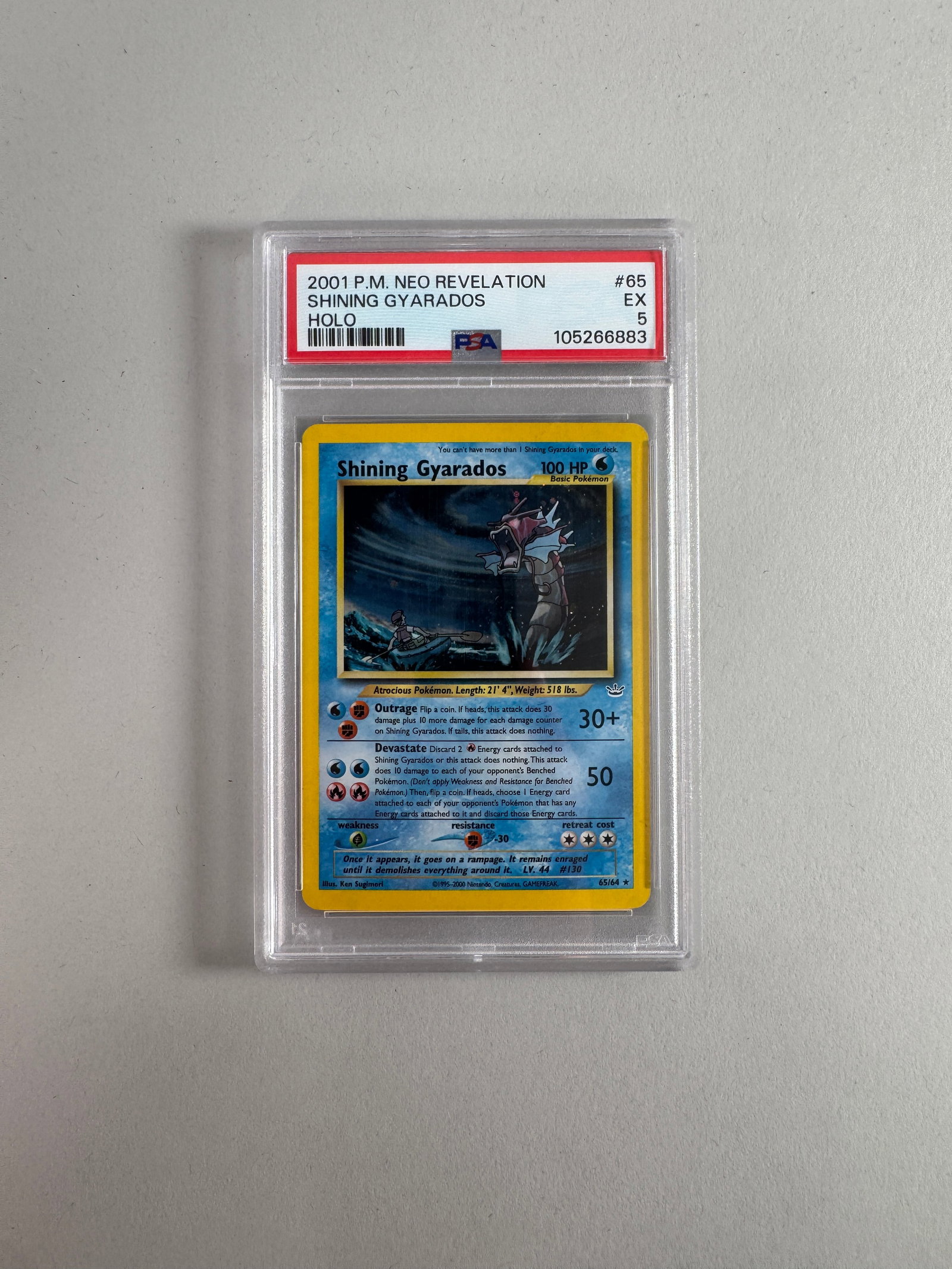 2001 Pokemon Neo Revelation Shining Gyarados Holo PSA EX #65: 2001 Pokemon Neo Revelation Shining Gyarados Holo card, graded EX #65 by PSA. Encased in protective plastic. Size: 12 x 8cm approx. 