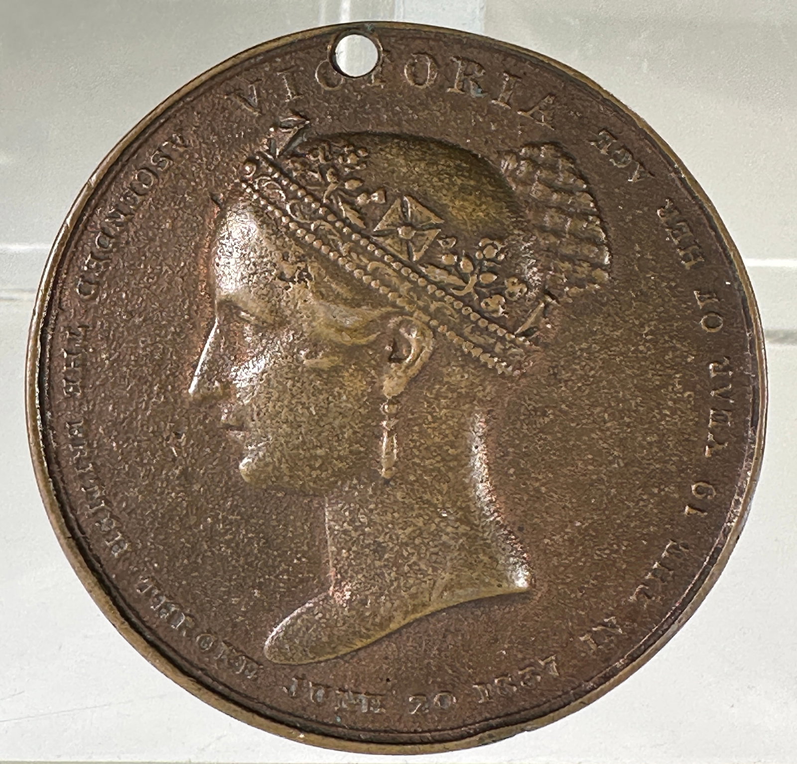 Queen Victoria Coronation Medal, 1838: Queen Victoria Coronation Medal, commemorating her coronation at Westminster Abbey on June 28, 1838. Obverse features a portrait of Victoria; reverse depicts the Queen enthroned.