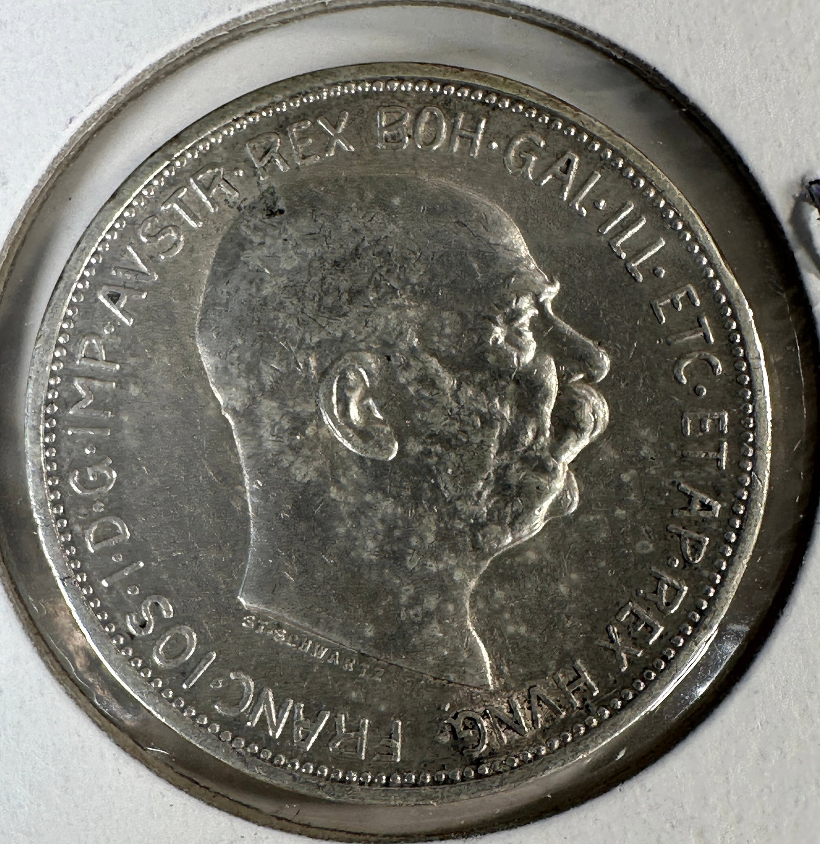 1912 Austria-Hungary 2 Corona .835 Silver Coin: 1912 Austria-Hungary 2 Corona .835 Silver Coin, featuring Franz Joseph I. The coin displays the Austro-Hungarian coat of arms on the obverse.