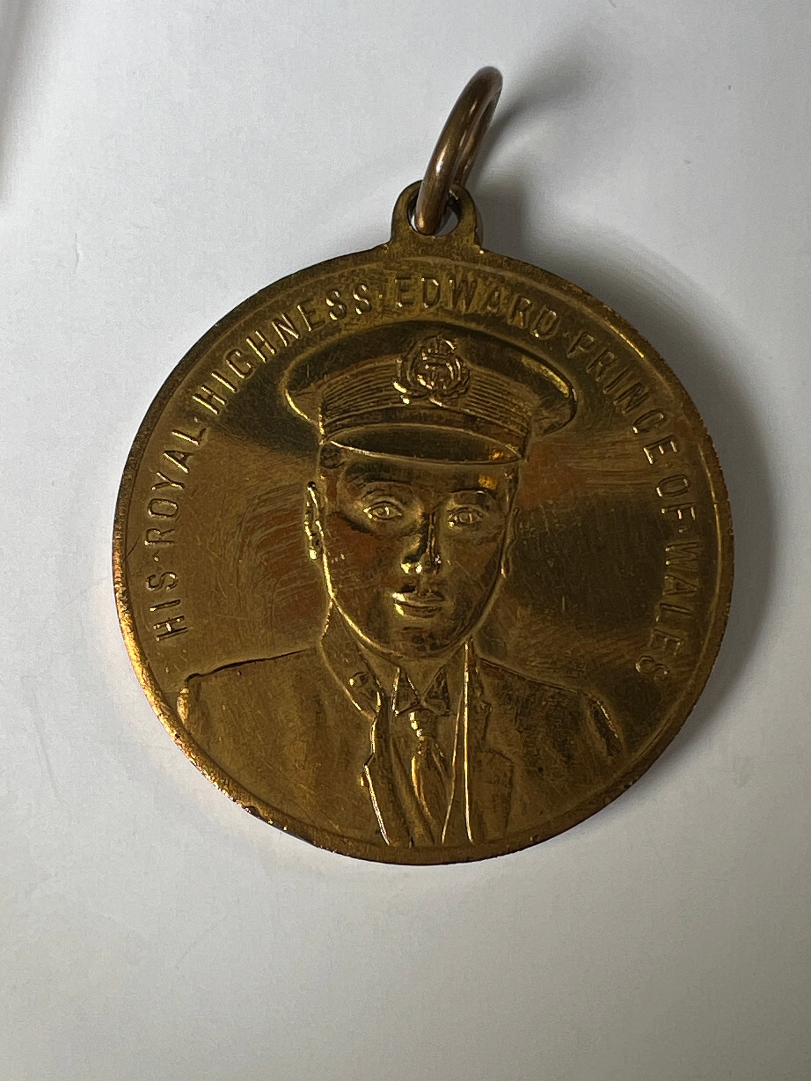 Edward Prince of Wales Medal 1911: Commemorative medal featuring Edward, Prince of Wales, 1911. Obverse depicts the Prince in uniform. Reverse features a coat of arms and Welsh inscription. Includes loop for wear.