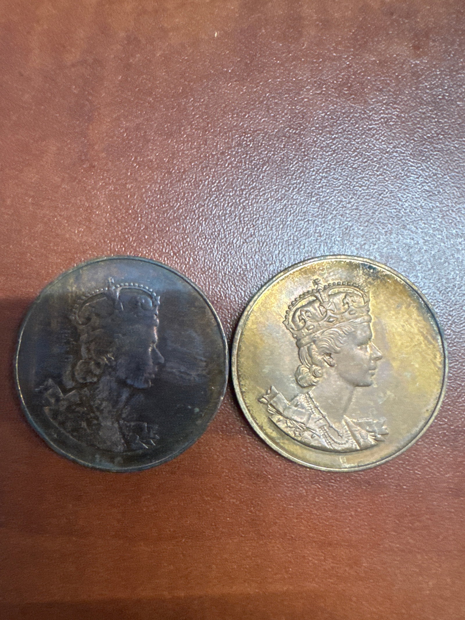 Three Coronation Medals 2 of Queen Elizabeth II: This lot features 3 commemorative medals 2 from the coronation of Queen Elizabeth II and one from the coronation of George IIII. 
