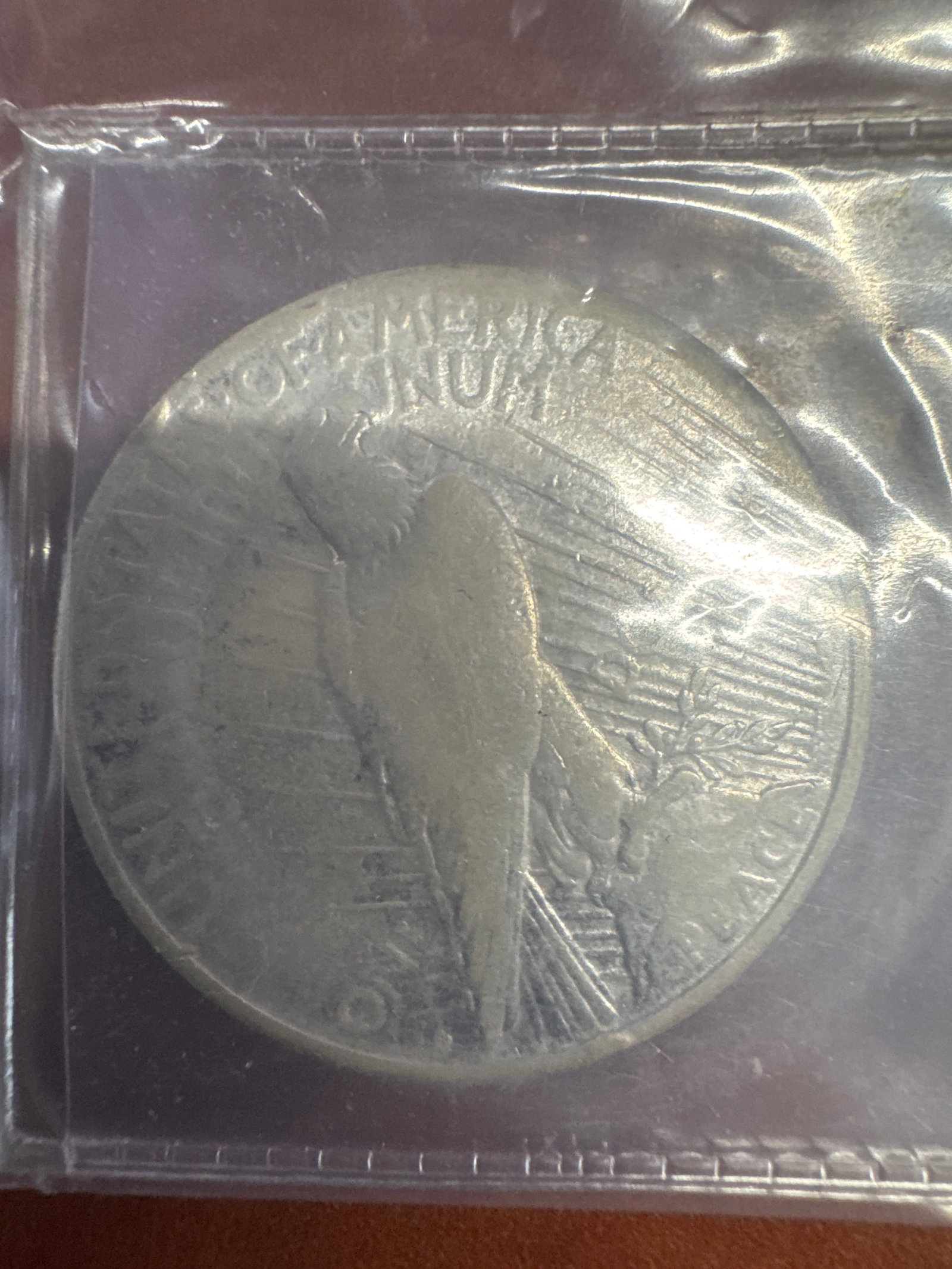 1922 Peace Silver Dollar Coin: A 1922 Peace Silver Dollar coin, featuring Lady Liberty on the obverse and an eagle on the reverse. 