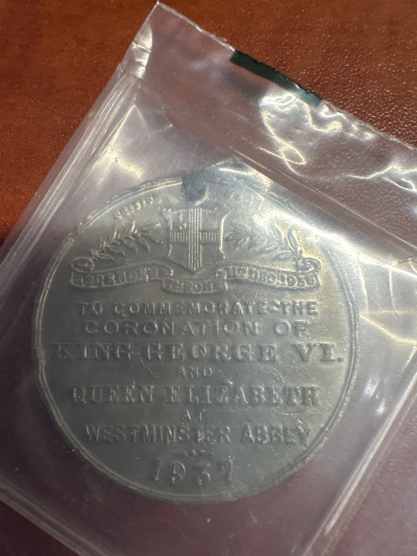 Medal Commemorating the Coronation of King George VI and Queen Elizabeth, 1937: A commemorative medal celebrating the coronation of King George VI and Queen Elizabeth at Westminster Abbey in 1937. The obverse features portraits of the King and Queen, while the reverse details the