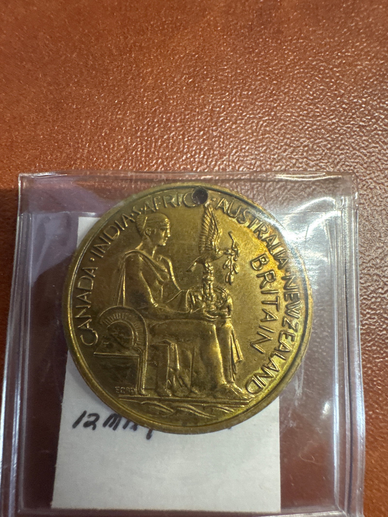 Coronation Medal of King George VI and Queen Elizabeth: A commemorative medal featuring portraits of King George VI and Queen Elizabeth on one side, and allegorical figures representing Canada, India, Africa, Australia, Britain, and New Zealand on the