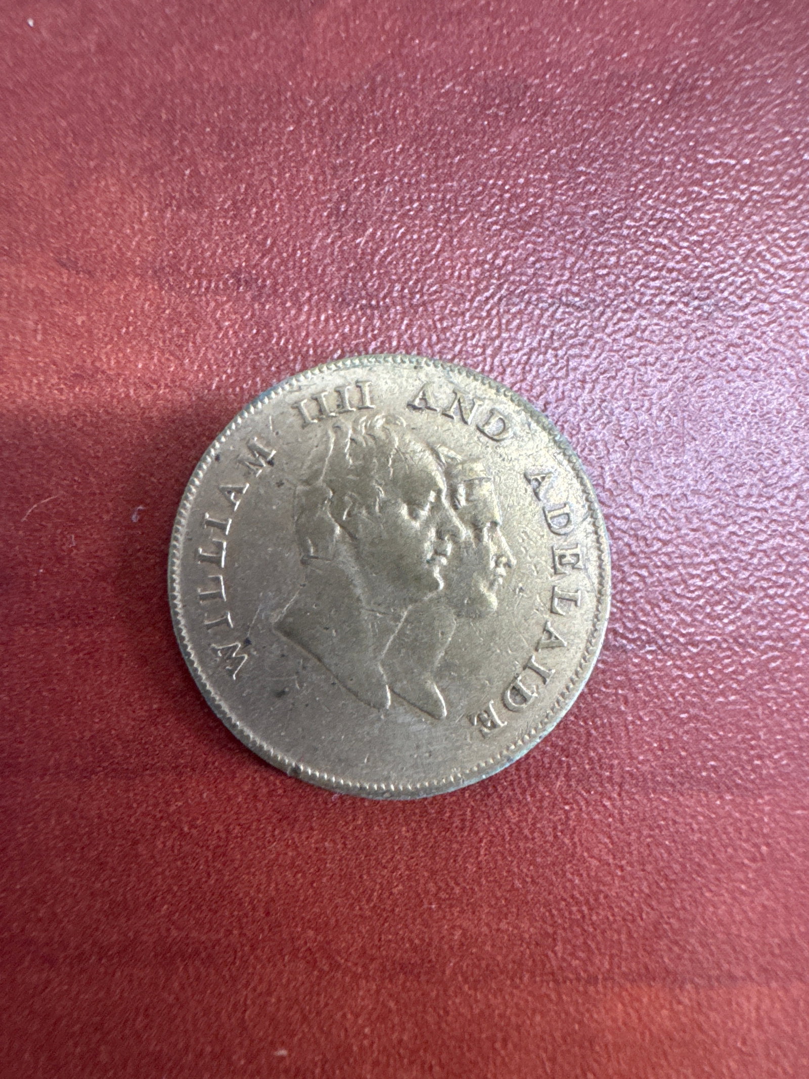 1831 William IV and Queen Adelaide Coronation Medal: This is a historical medal commemorating the coronation of William IV and Queen Adelaide in 1831. The obverse features the conjoined busts of William IV and Adelaide. The reverse depicts a crown and t