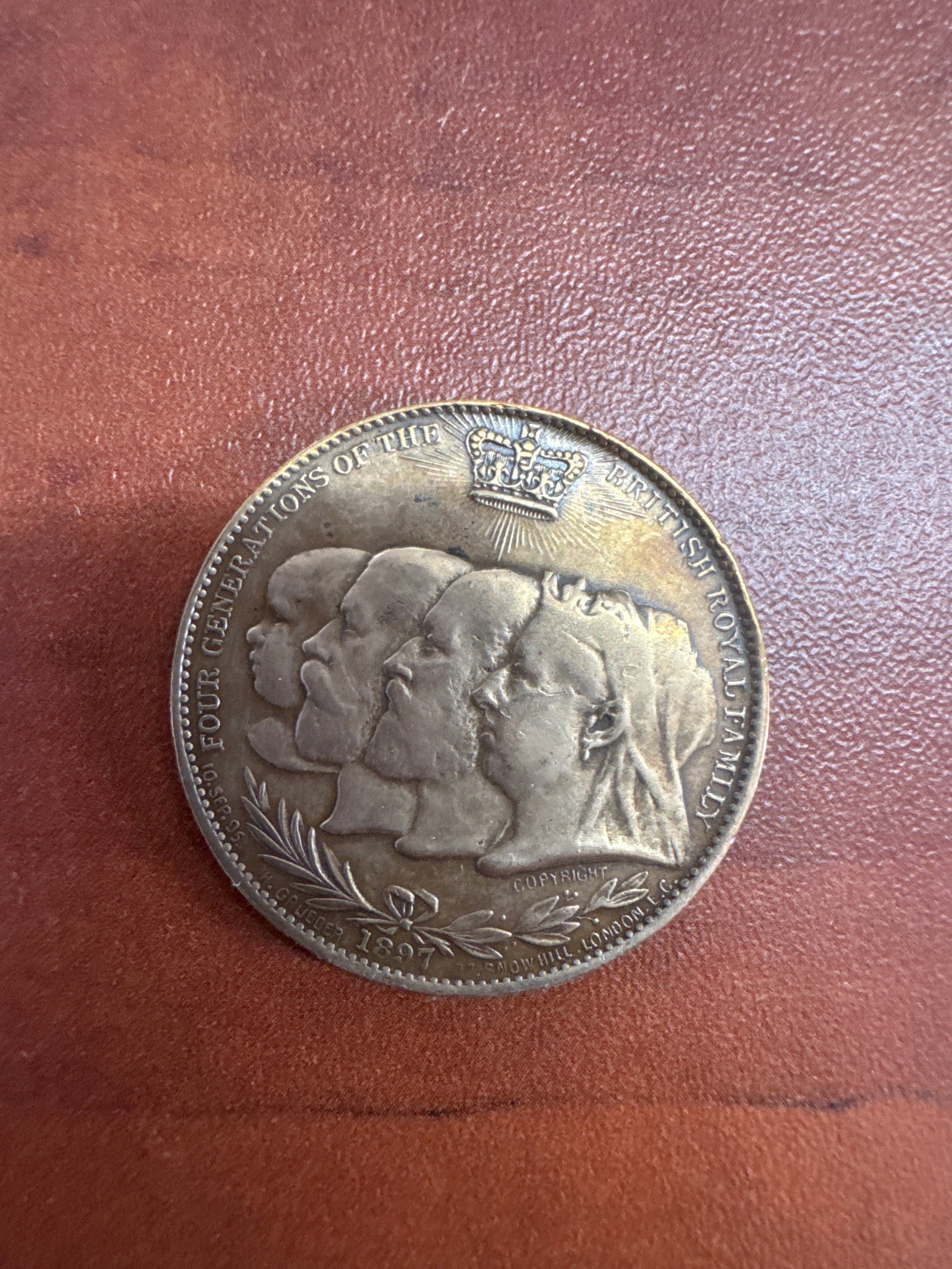 1897 Commemorative Coin - Four Generations of the British Royal Family & Diamond Jubilee: This commemorative coin celebrates the Diamond Jubilee of Queen Victoria's reign (1837-1897). One side features the profiles of four generations of the British Royal Family, with the inscription &